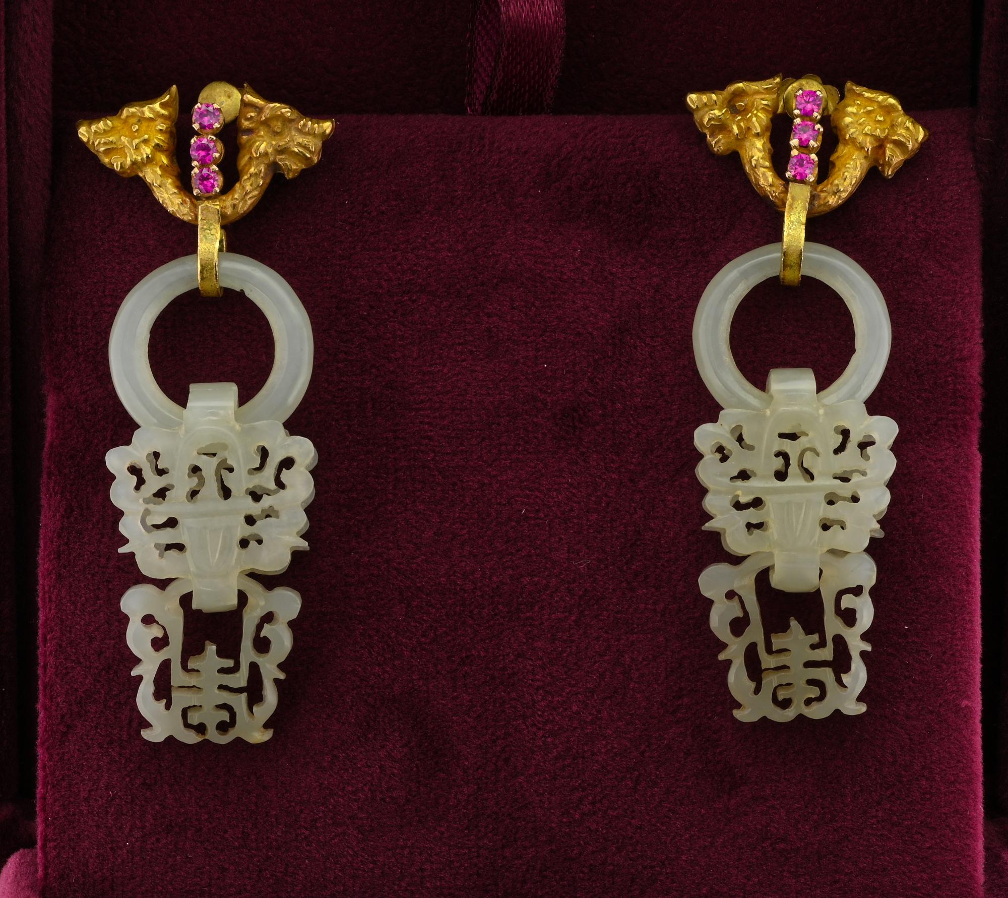 Quite spectacular antique pair of white Jade earrings 1900 circa
They are made with a top of solid 18 Kt featuring Dragon heads beautifully sculptured, enhanced with Red stones
The White Jade sections is articulated into three sections with symbolic