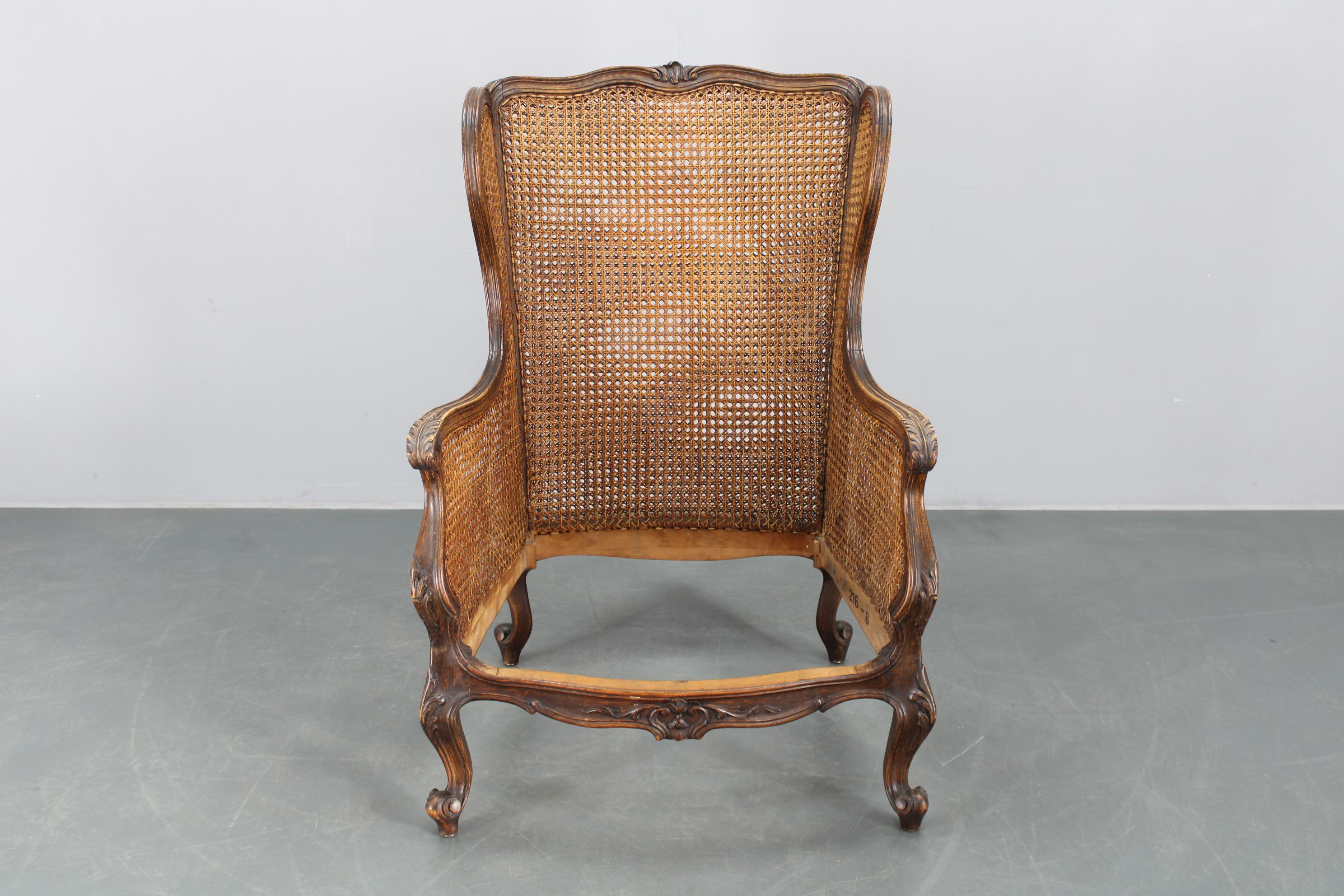 Antique Carved Wing Chair with Cane Sides , Czechoslovakia For Sale 8