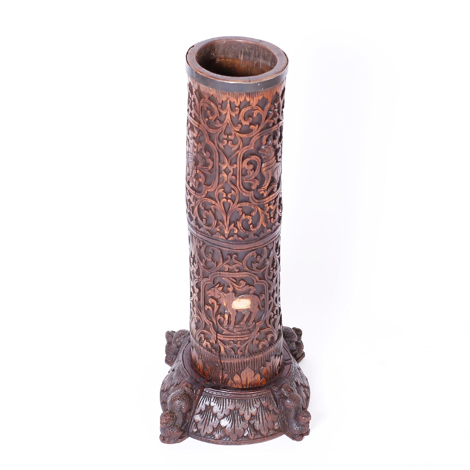Enchanting antique Anglo-Indian umbrella stand crafted from a mahogany tree with elaborate floral and animal carvings sitting on a base with carved leaves and four cats. Interesting historical note, this piece at one time lived in London, as noted