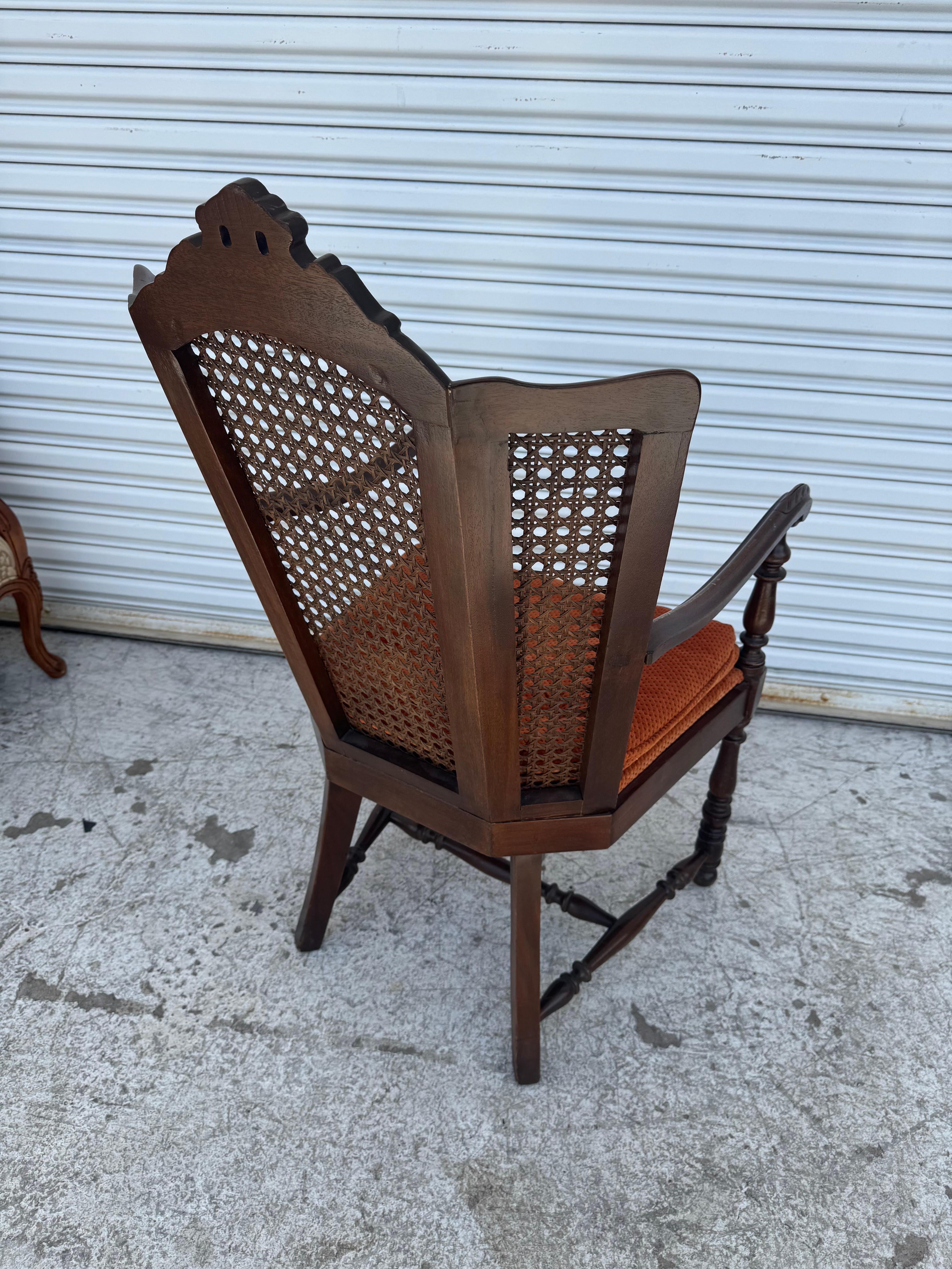 Mid-20th Century Antique Carved Wood Armchair with Cane Back For Sale