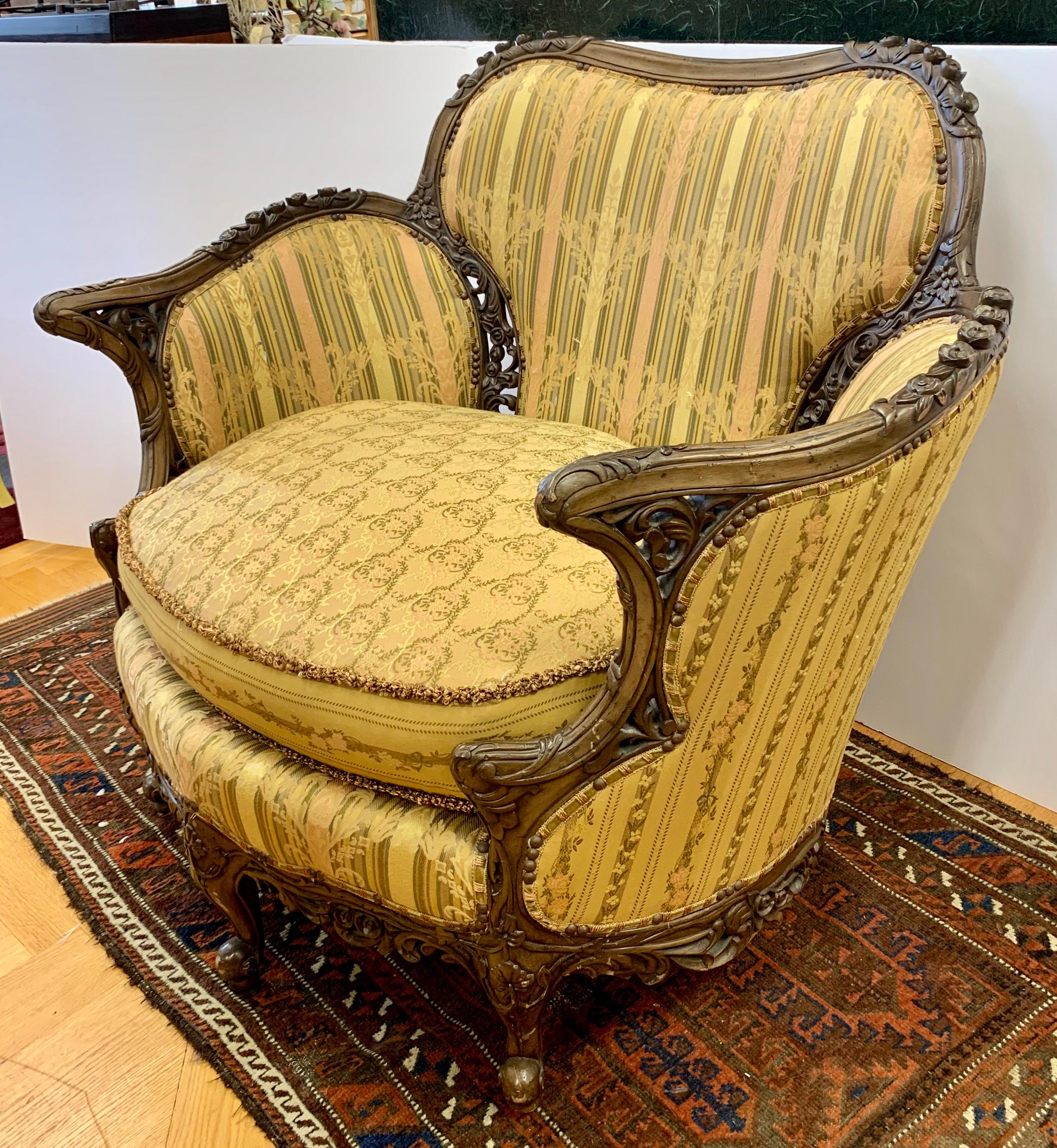 Turn of century England, upholstered reading chair. Larger scale with newer upholstery, see pictures.
Ornate fruitwood carvings throughout.