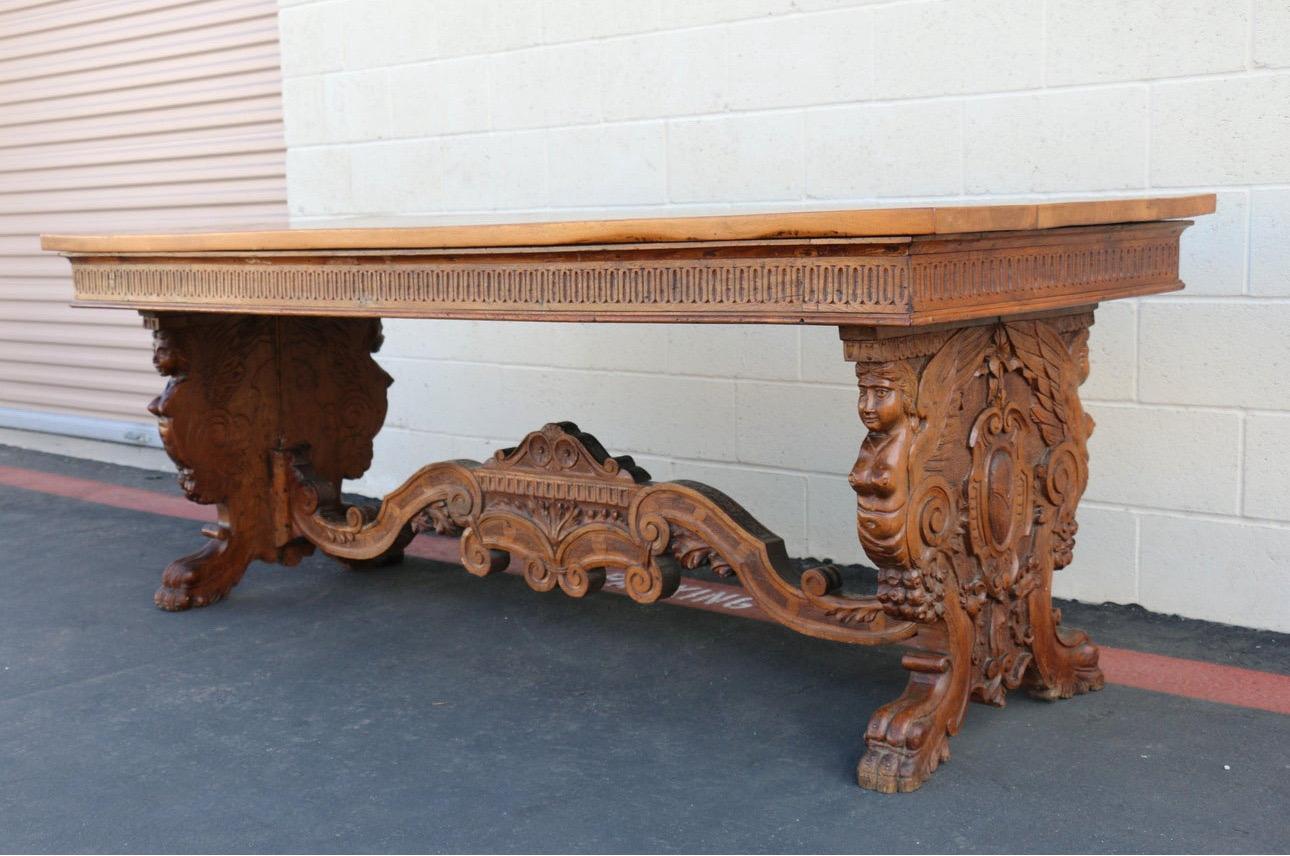 Spectacular Antique Carved Wood Writing Desk. In good condition. This table has so many carved details. Really easy to transport it from a place to another because the top comes out and the base is three separate pieces. Just a wonderful piece.