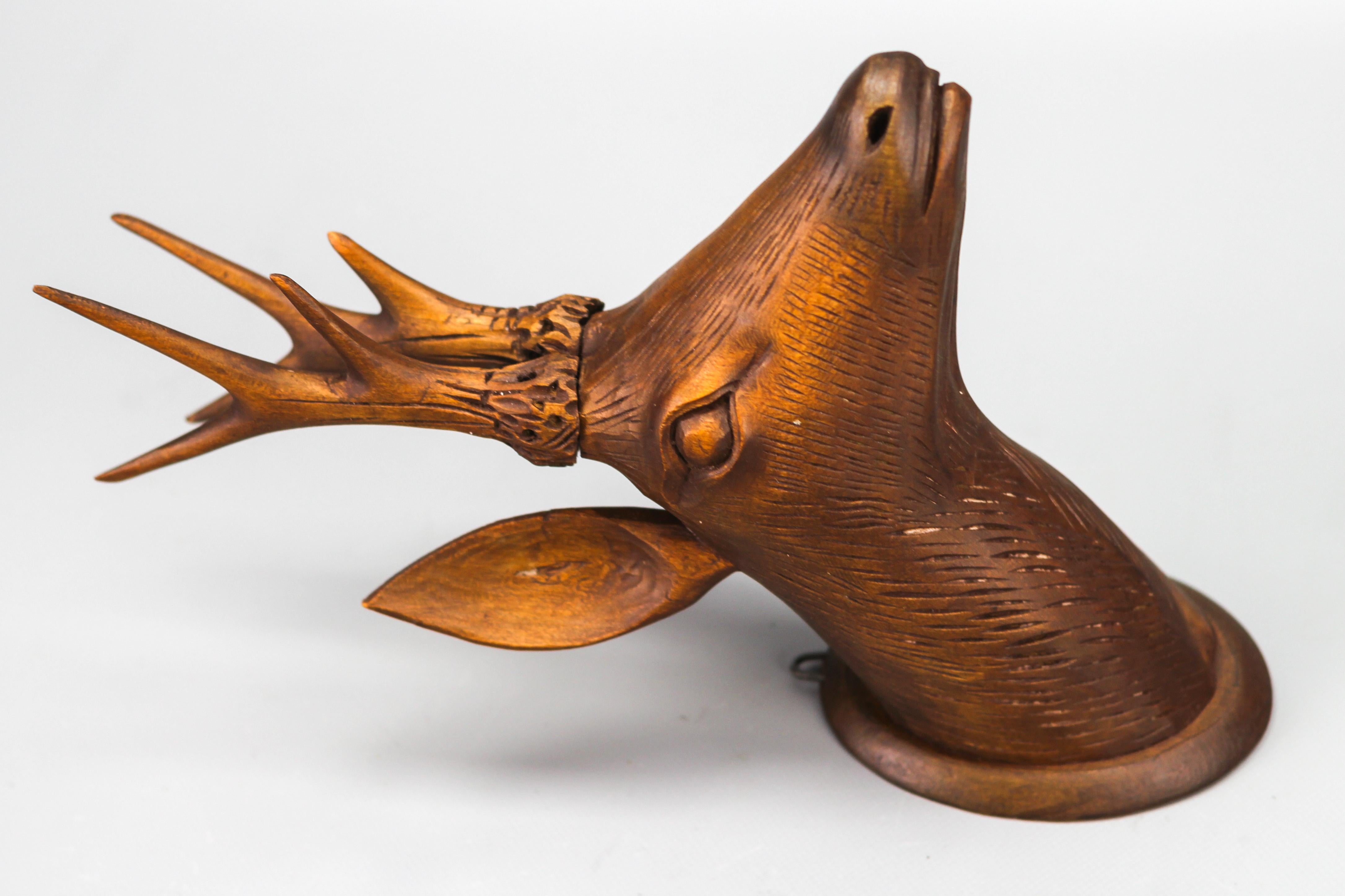 Antique Carved Wooden Deer's Head Wall Decoration, Germany, from ca. 1920
A beautiful antique wall decoration - entirely from linden wood carved deer's head on an oval base, toned in dark brown color.
Dimensions: height: 30 cm / 11.81 in; width: 10