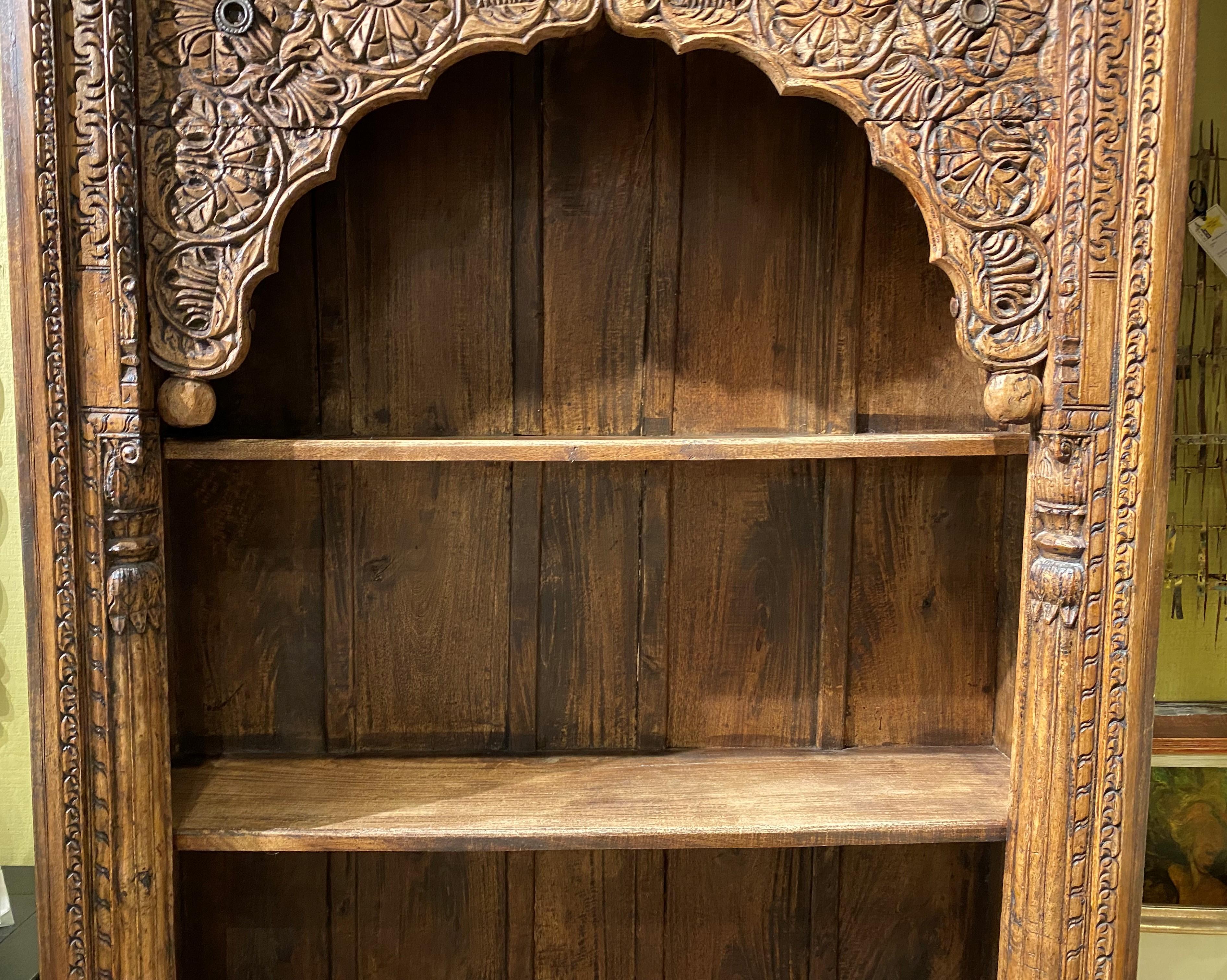 carved indian bookcase