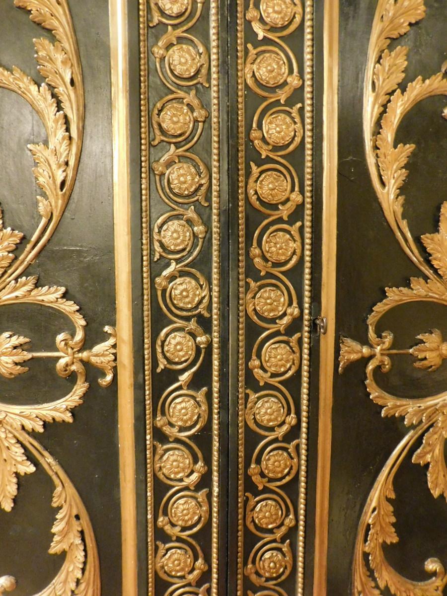 black and gold armoire