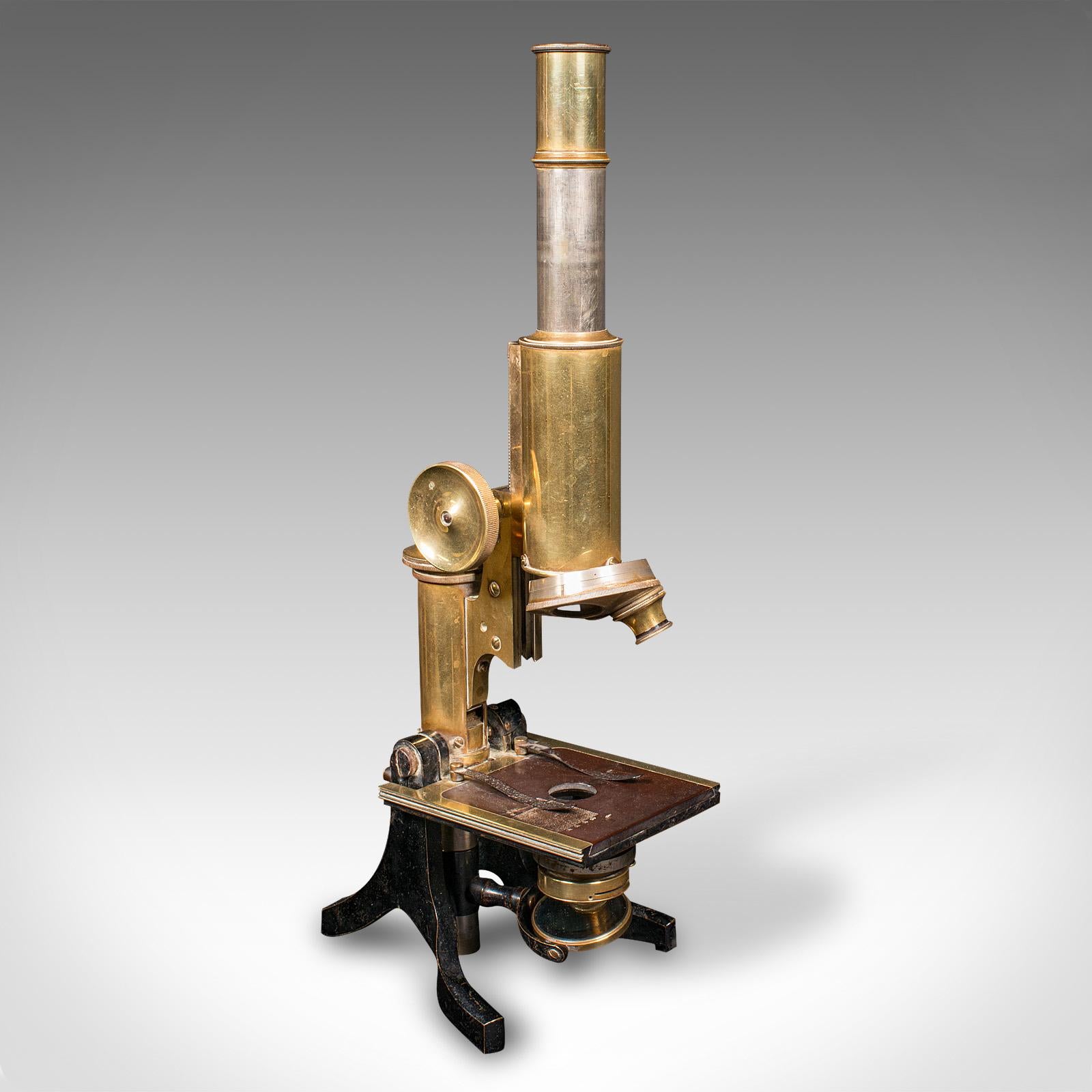 This is an antique cased microscope. An English, enamelled metal and brass scientific instrument by J. Swift & Son of London, dating to the late Victorian period, circa 1900.

Presented in a quality case, the microscope of appealing Victorian