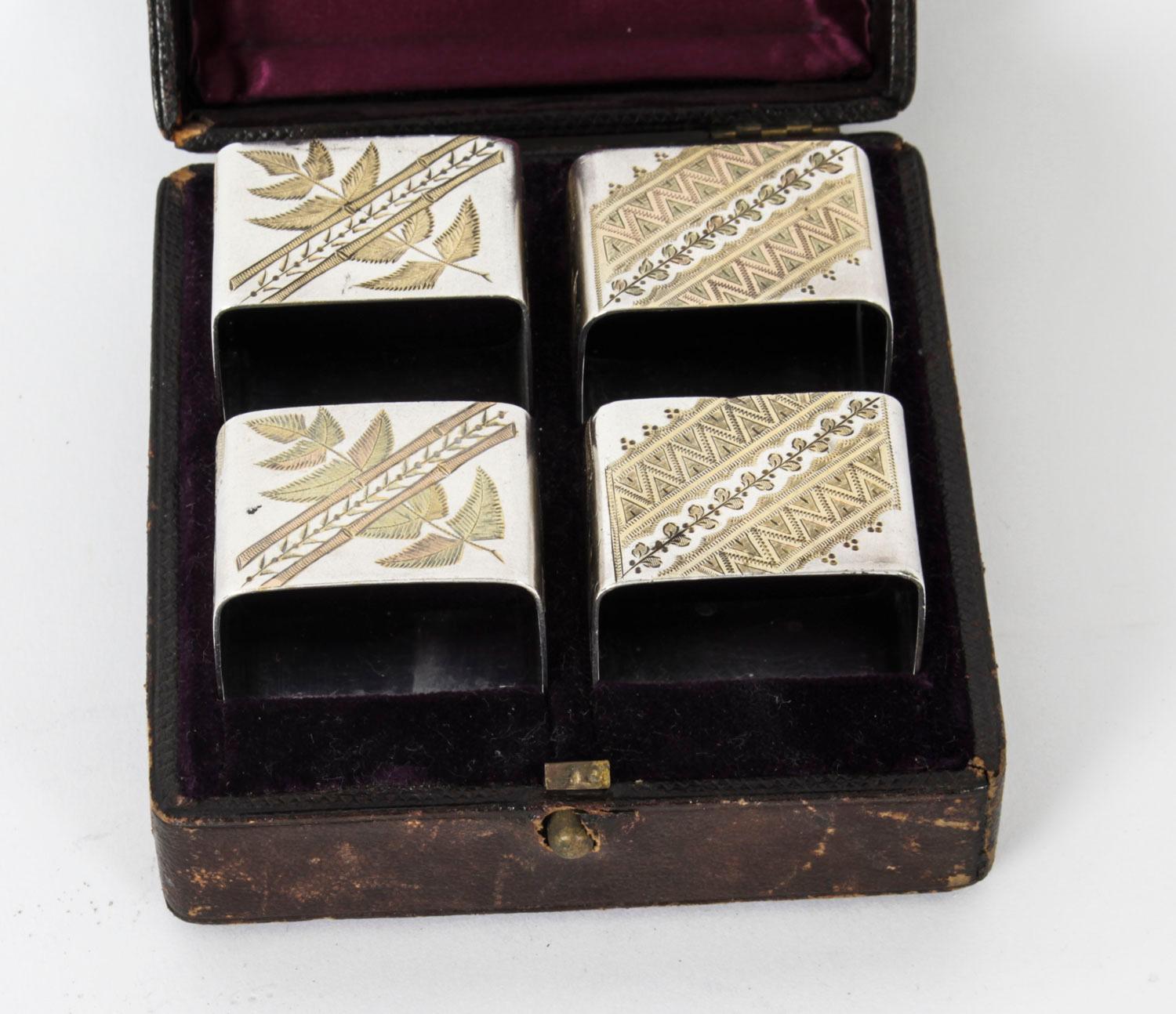 This is a superb set of four silver plated and engraved napkin rings in their original leather and purple silk lined casket, by the renowned Victorian silversmith and retailer Elkington & Co, late 19th century in date.

The quality and