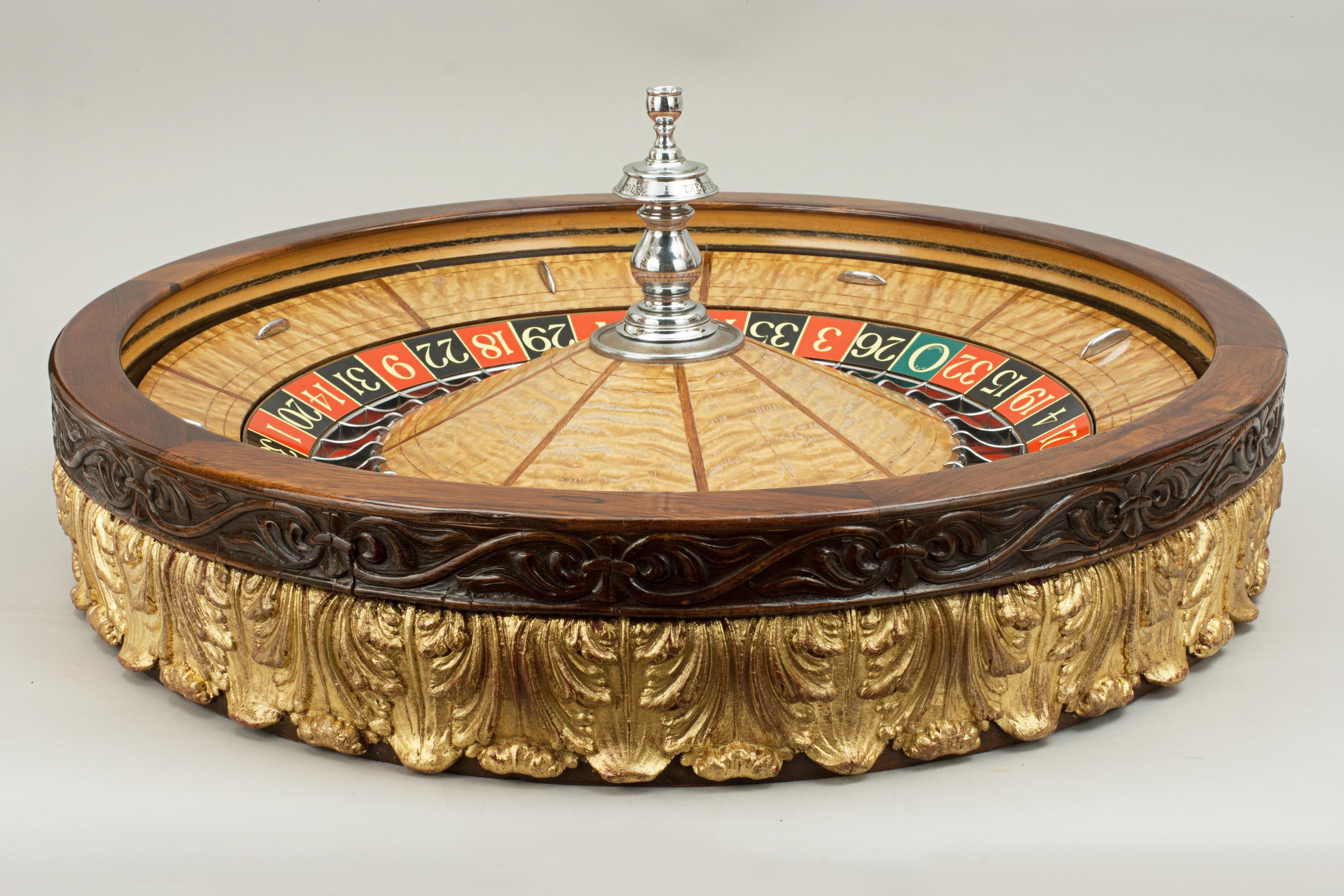 Large George Mason Co. Casino roulette wheel
A rare and large late 19th, early 20th century American professional saloon roulette wheel, the turret marked 'THE GEO. MASON CO. MAKERS. DENVER. COLO.' with exotic woods and the circular hardwood outer
