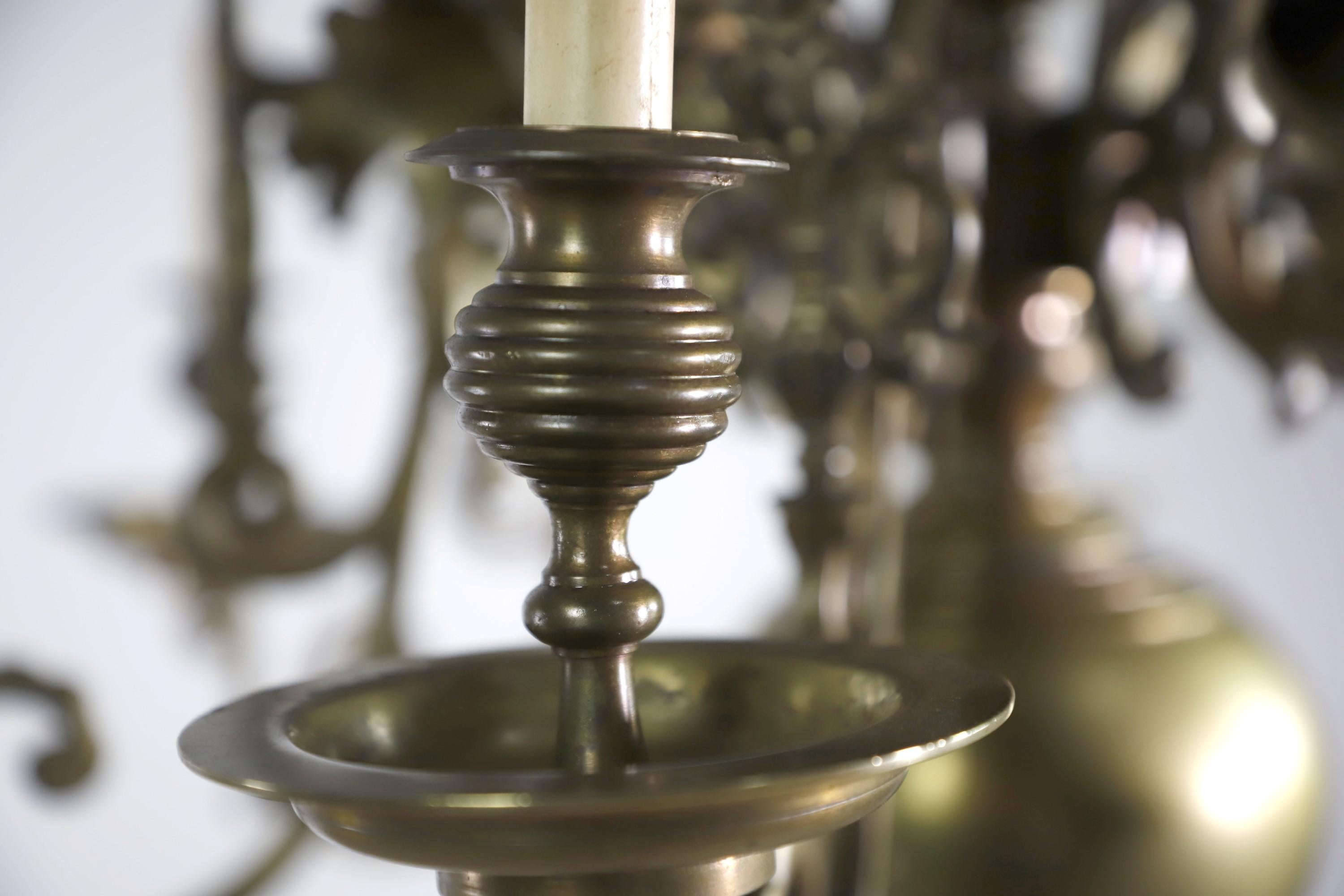 Antique 6 arm cast brass chandelier featuring a floral design. Takes 6 candelabra base lightbulbs. Cleaned and restored.  Please note, this item is located in our Scranton, PA location.