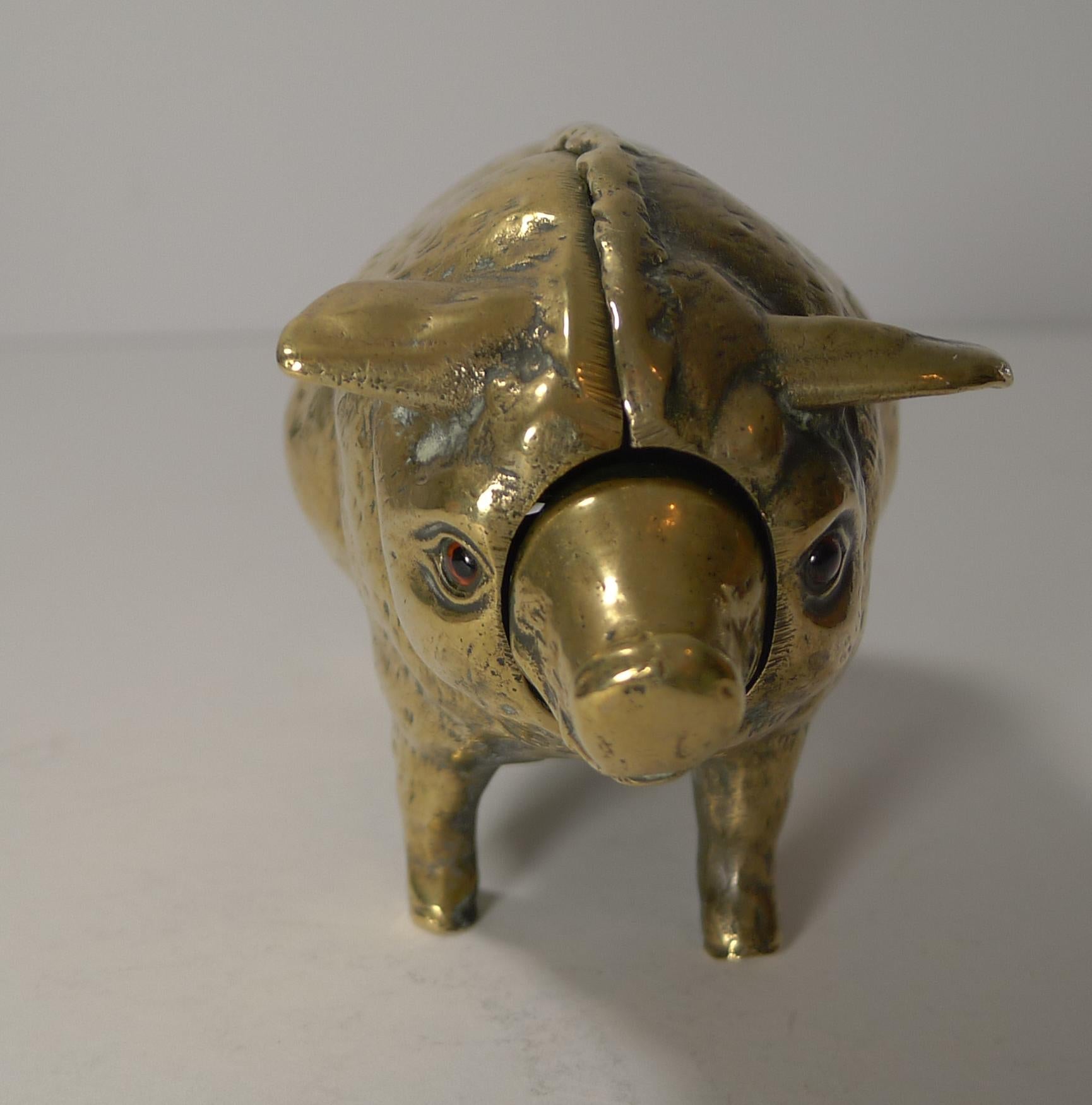 A rare find, this fabulous figural desk bell was cast in brass or polished bronze in the form of a pig with a quality screwed construction. The mechanical bell can be would from the underside and then rung either by the snout or tail (alternately).