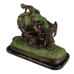 Scène de chasse à l'éléphant et au lion en bronze moulé Antonio Amorgasti Belgique 1925