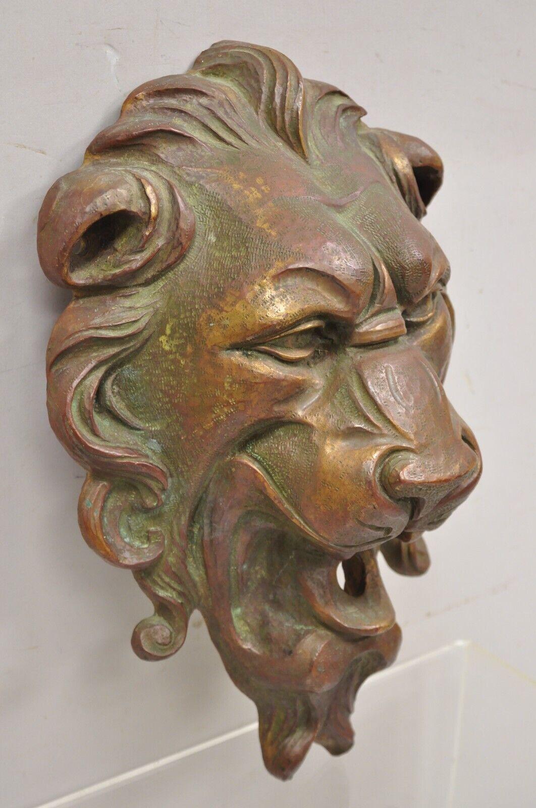 Antique Cast Bronze English Regency Lion Head Garden Wall Mounted Fountain Plate. Item features heavy cast bronze construction, remarkable detail, weights approx. 30 lbs. Does not include hose or pump. Circa Early 20th Century. Measurements: 16.5