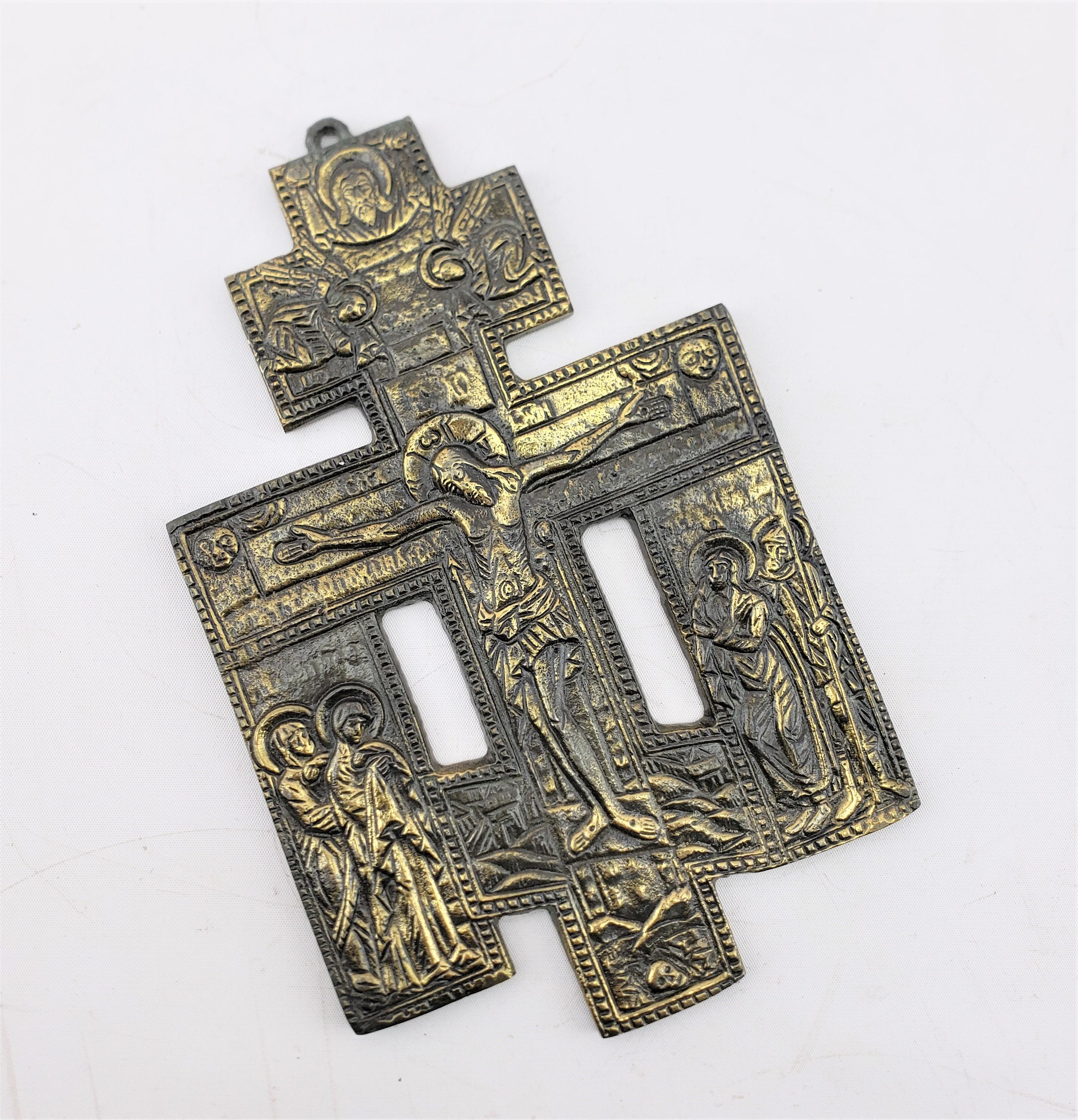 This antique religious icon is unsigned, but presumed to have originated from Italy and date to approximately 1920 and done in the period Art Deco style. The cross or crucifix is done in cast bronze and depicts Jesus with his Disciples. The crucifix