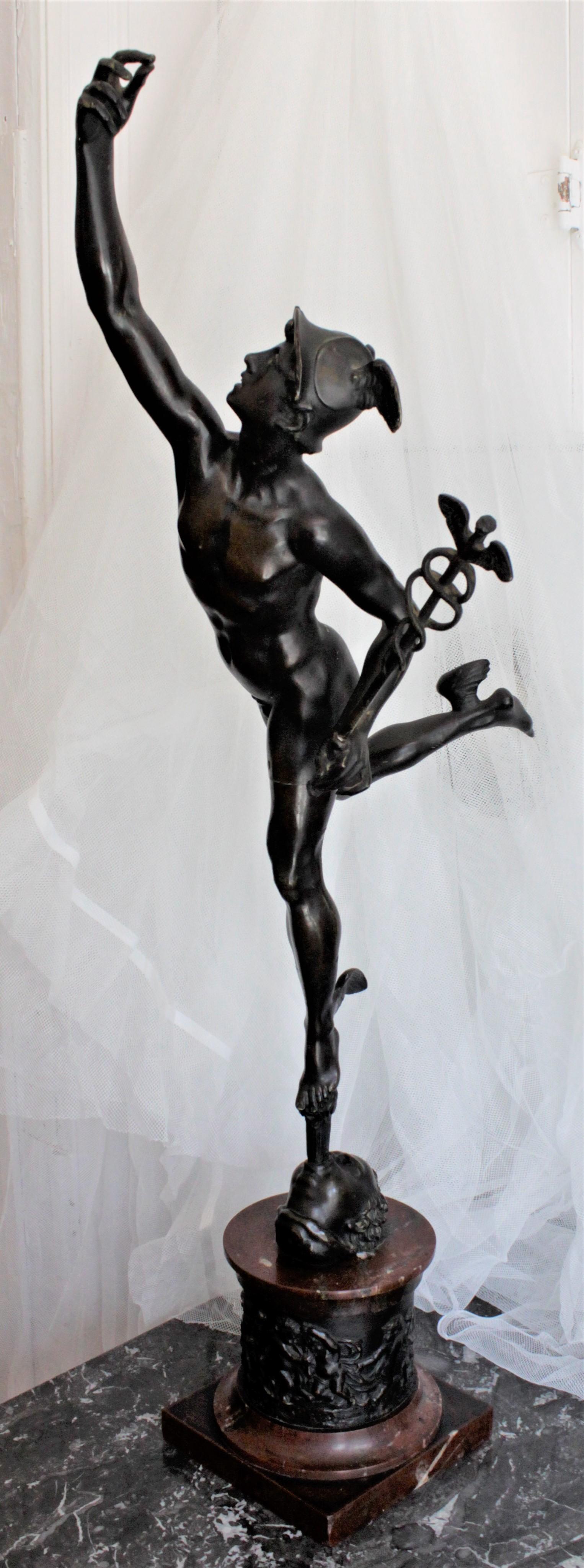 This cast and patinated bronze sculpture of either the mythological god mercury or Hermès is unsigned, but presumed to have been made in France in approximately 1850 in the Classical style. The winged male figure is holding a caduceus and standing