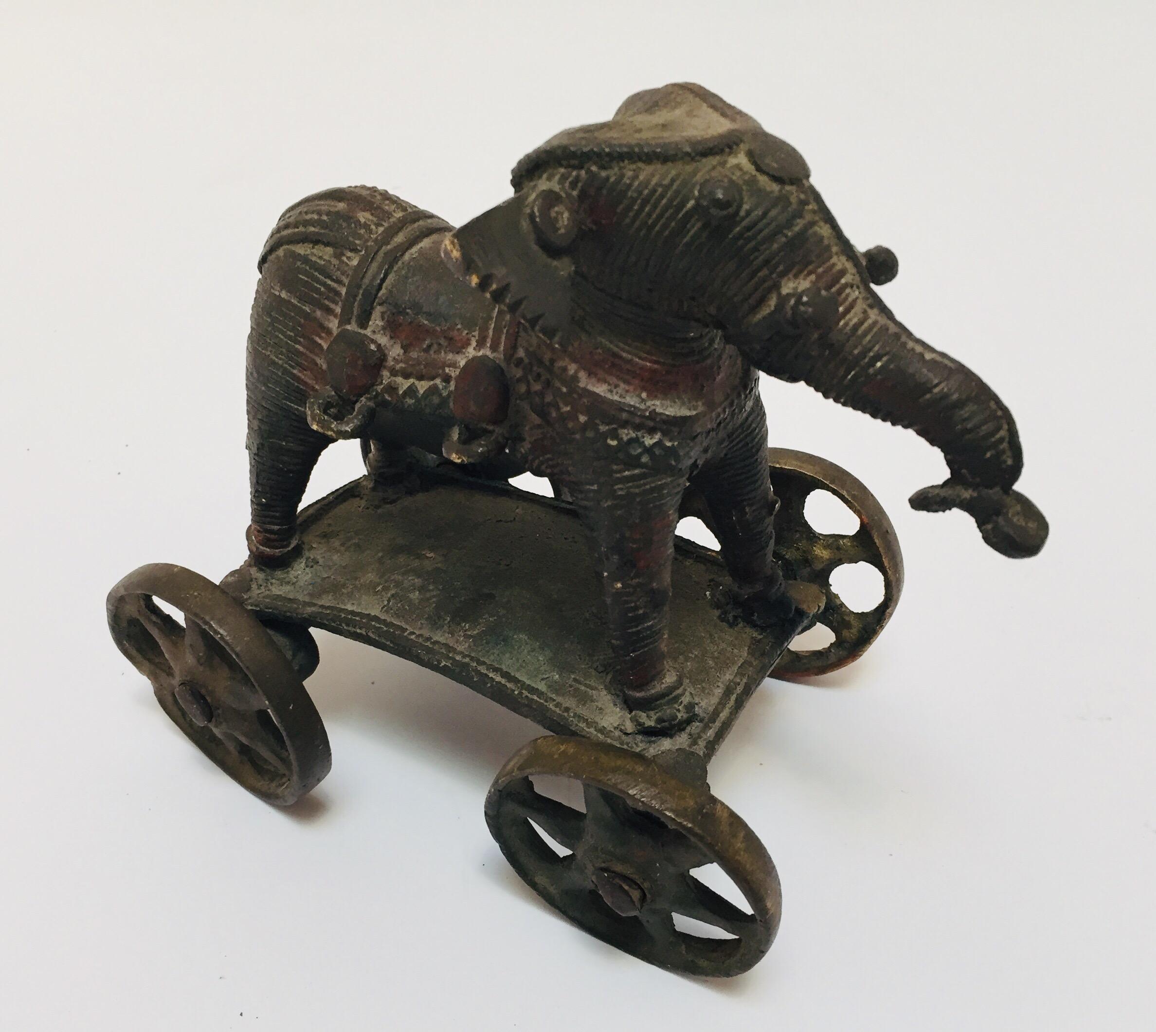 Antique cast bronze elephant temple toy on wheels from India.
This beautifully patinated brass temple elephant on wheels is from Bhundi in Rajasthan.
This would look perfect on a desk and is heavy enough to use as a paperweight
19th century Hindu