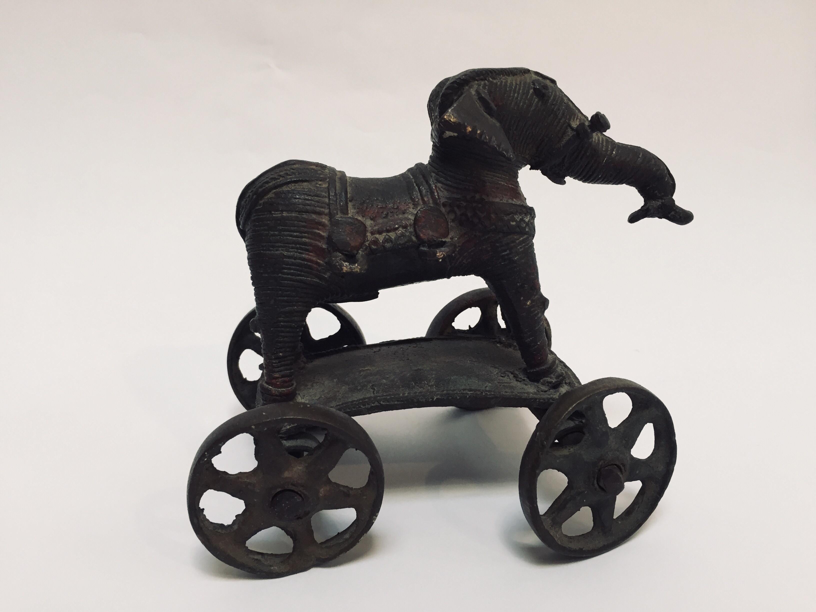 antique toy elephant on wheels
