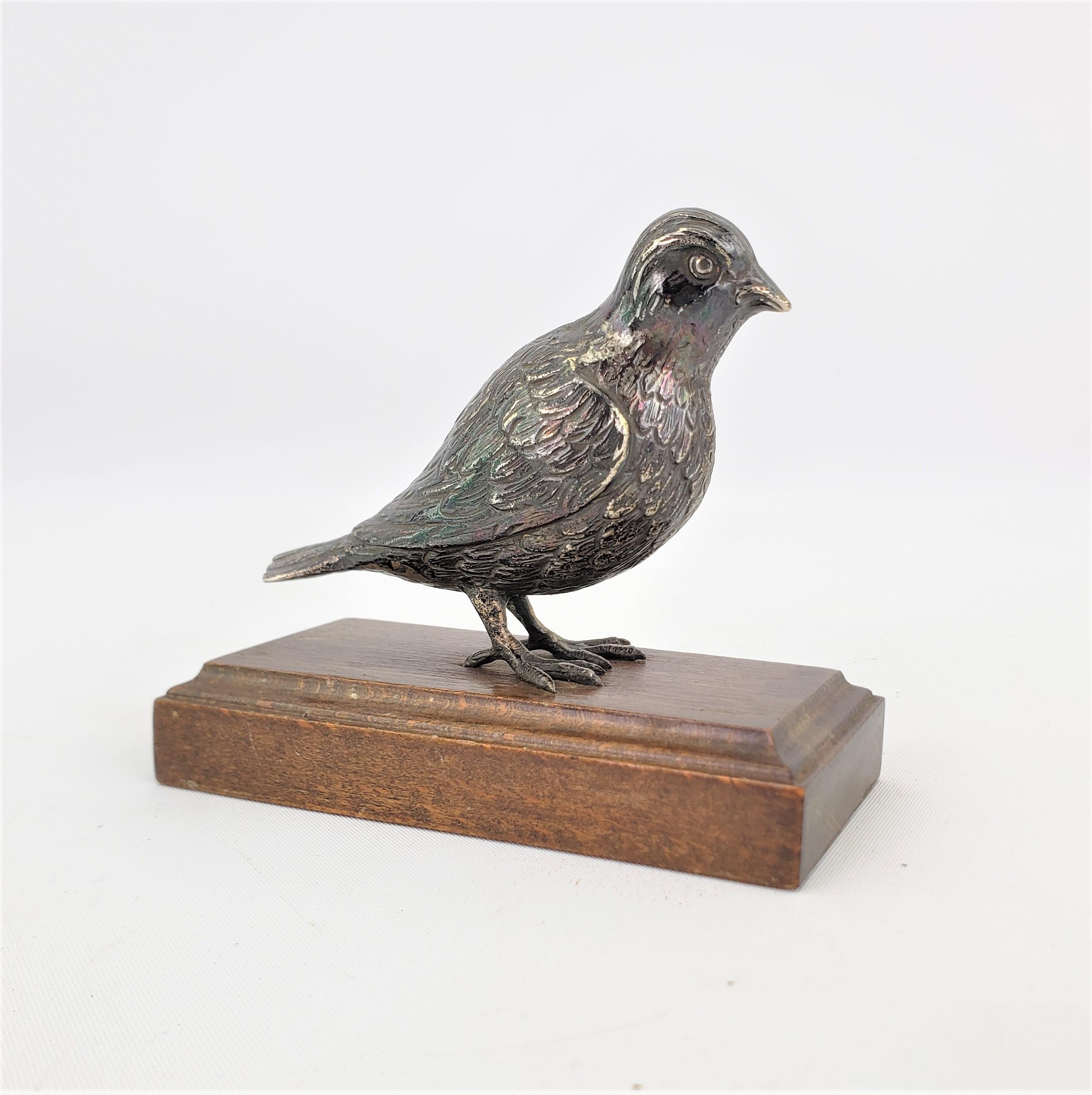 This antique cast silver bird sculpture is unsigned, but presumed to have originated from Europe, likely Austria or Italy and date to approximately 1920 and done in a realistic style. The cast silver bird is very well executed showing realistic