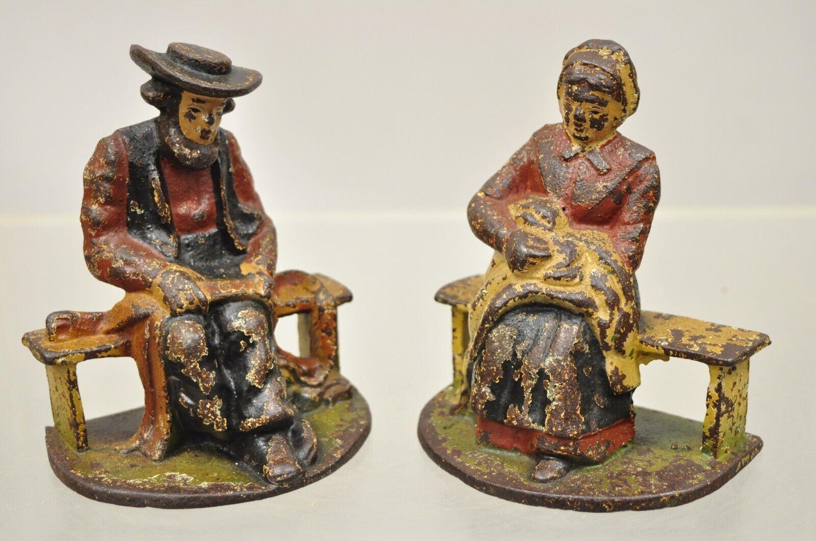 Antique cast iron Amish man and woman couple bookends - a pair. Item features nice small size, original distressed paint, very nice antique pair. Circa early 1900s. Measurements: 4.5