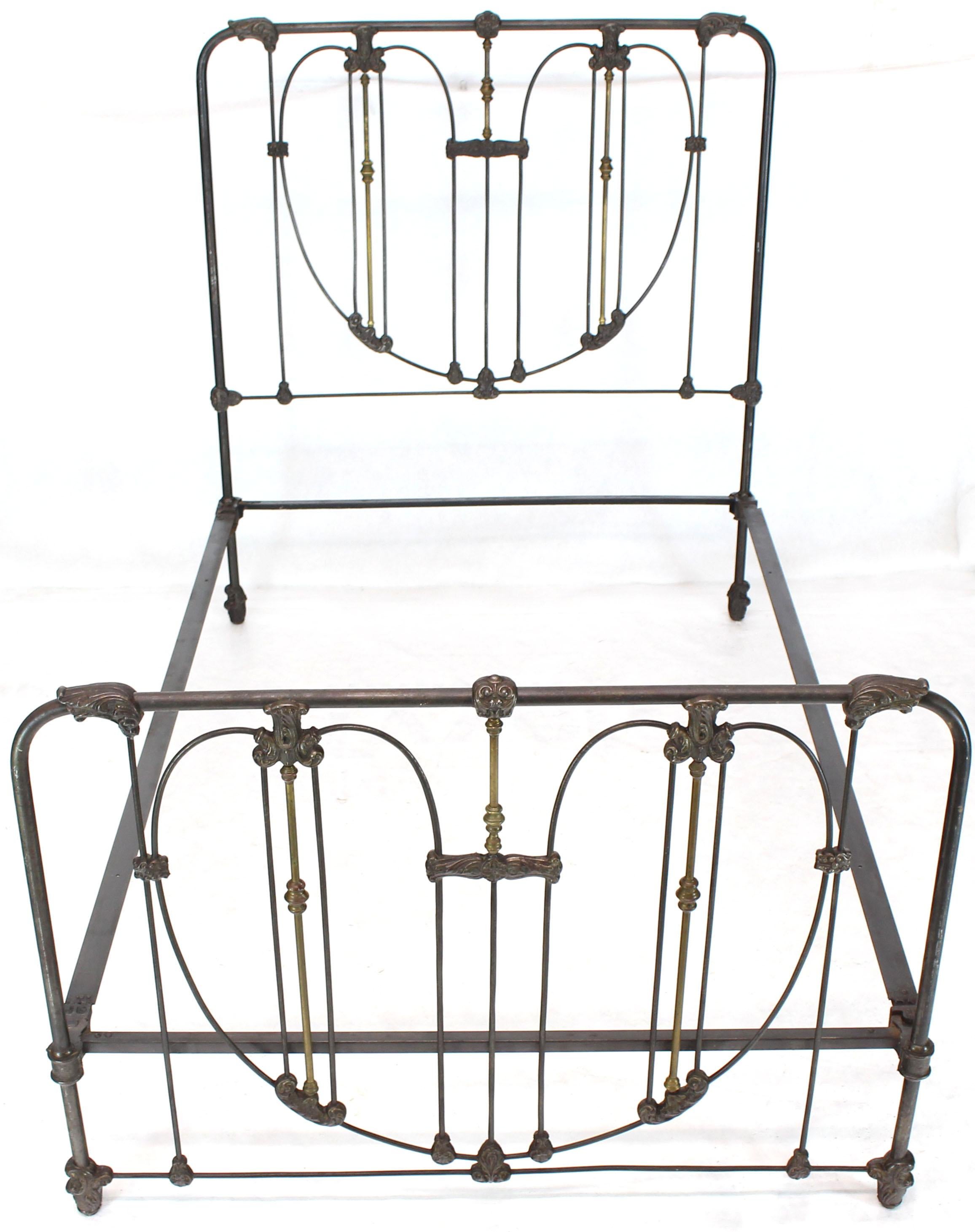 Very pretty heart pattern footboard and headboard full size antique cast iron and brass bed with rails.