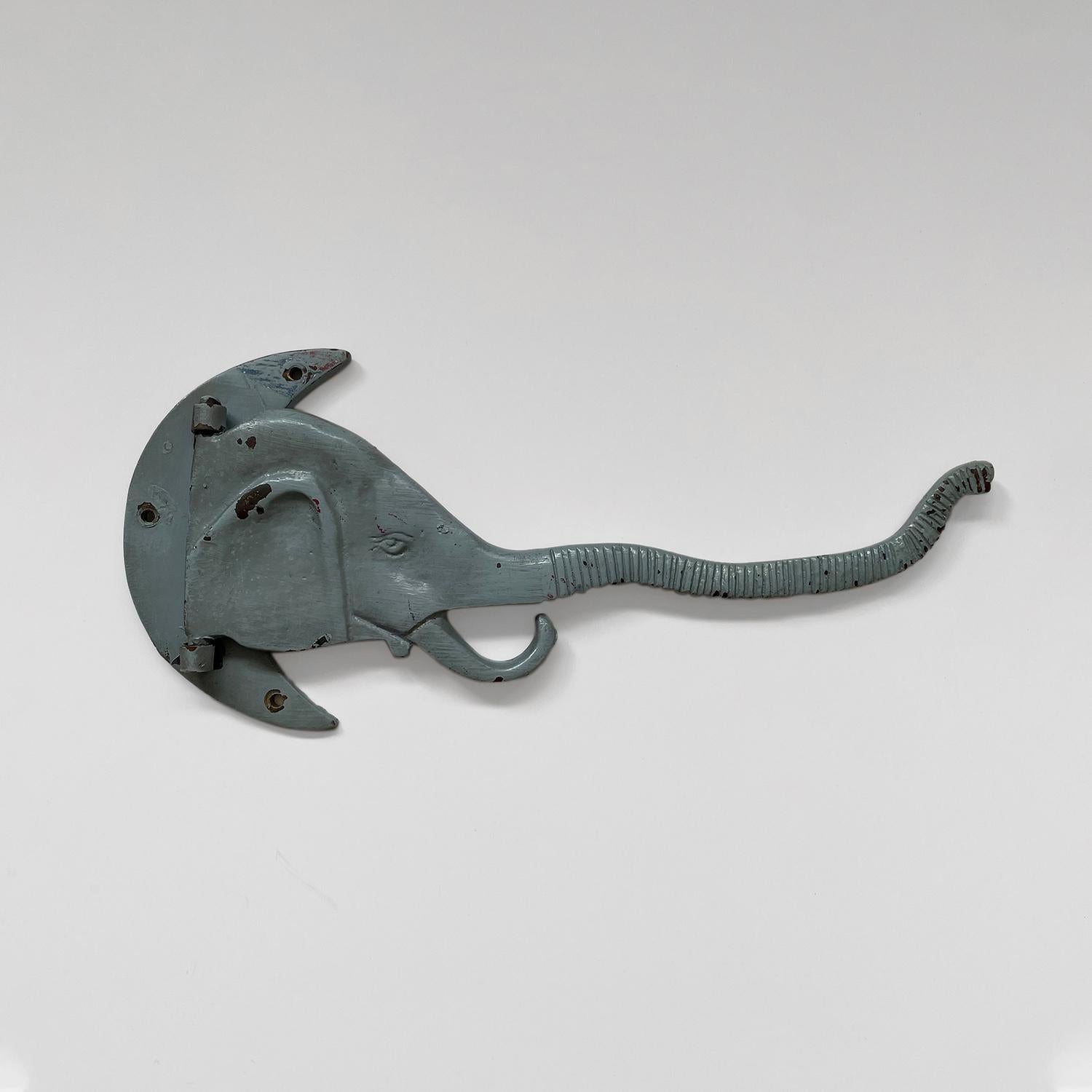 Antique cast iron articulating wall hook
Early 20th century
This piece is a work of art
The long articulating elephant trunk serves as a light weight storage hook which puts the fun in functional
Wall mounted hook is supported by a single crescent