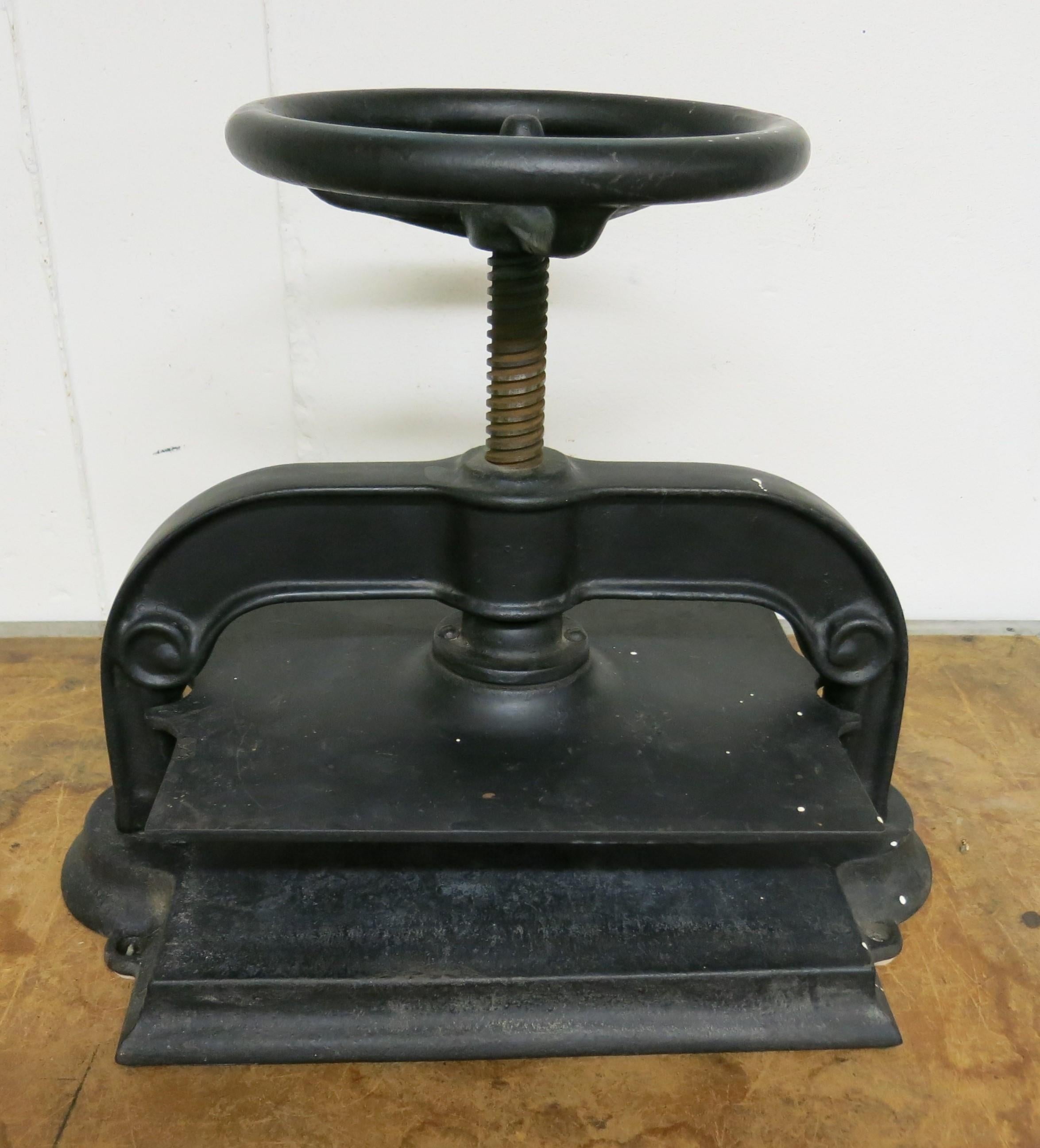 Antique cast iron book press, most likely Bradley and Hubbard. It is 19