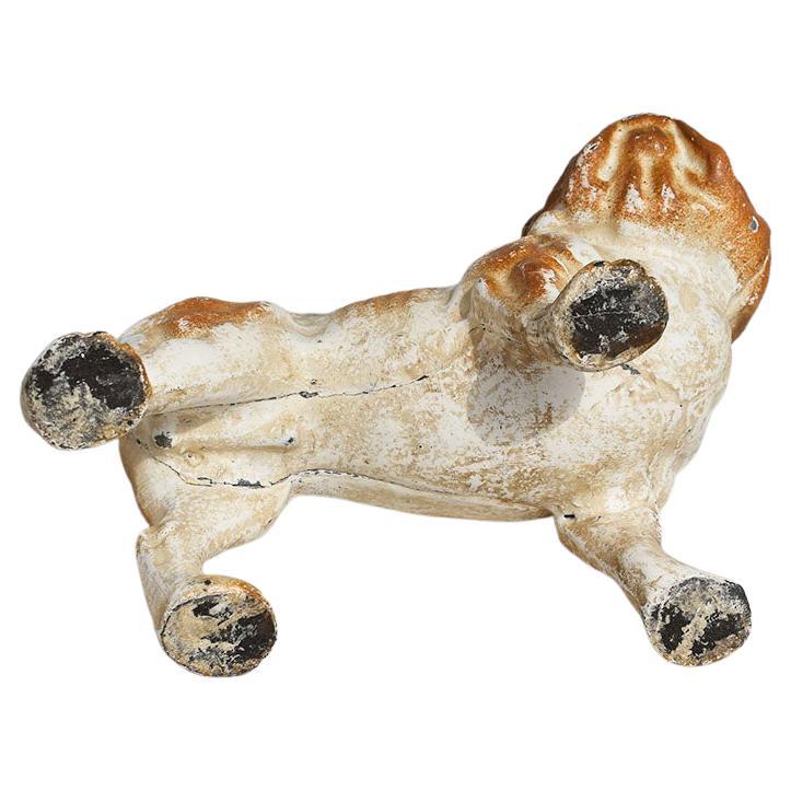 An antique cast iron bulldog piggy bank. Created in the 1920s, this piece is painted in brown and cream. And would make a fabulous addition to a nursery or child's room. A slot is located at the top for inserting coins. 

Dimensions:
8.5