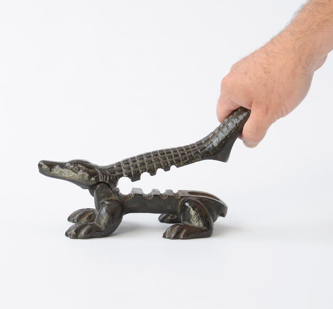 This cast iron crocodile cork press can be dated in the late 19th or early 20th century.
This crocodile is a decorative object with a wonderful history. It is in very good condition.
Until the 1930s, corks were used to seal bottles of medical