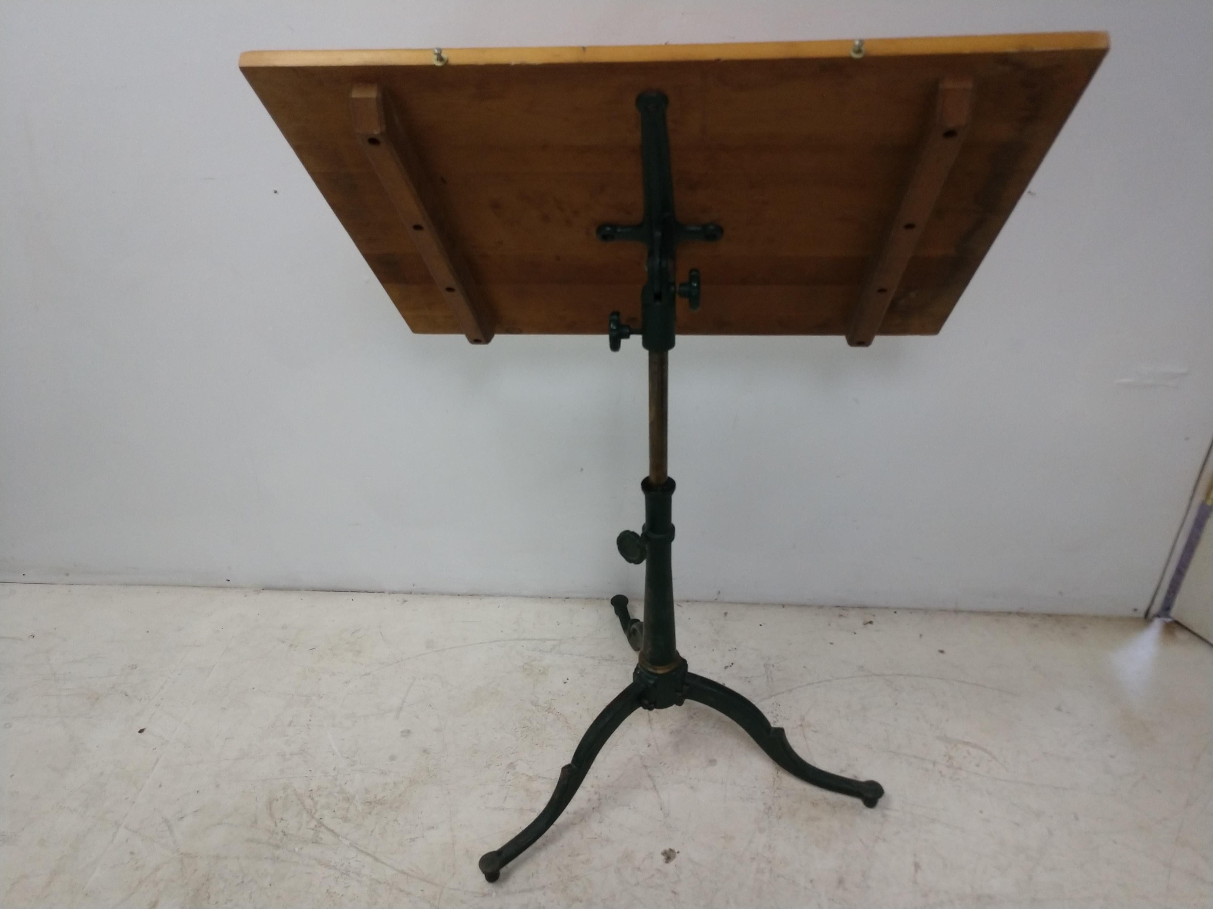 Antique cast iron drafting table by the Anderson Co. which later became the Anco drafting table supplier which is one the largest manufacturer of drafting tables. This table will totally disassemble for easy parcel post shipping. Cast iron legs and