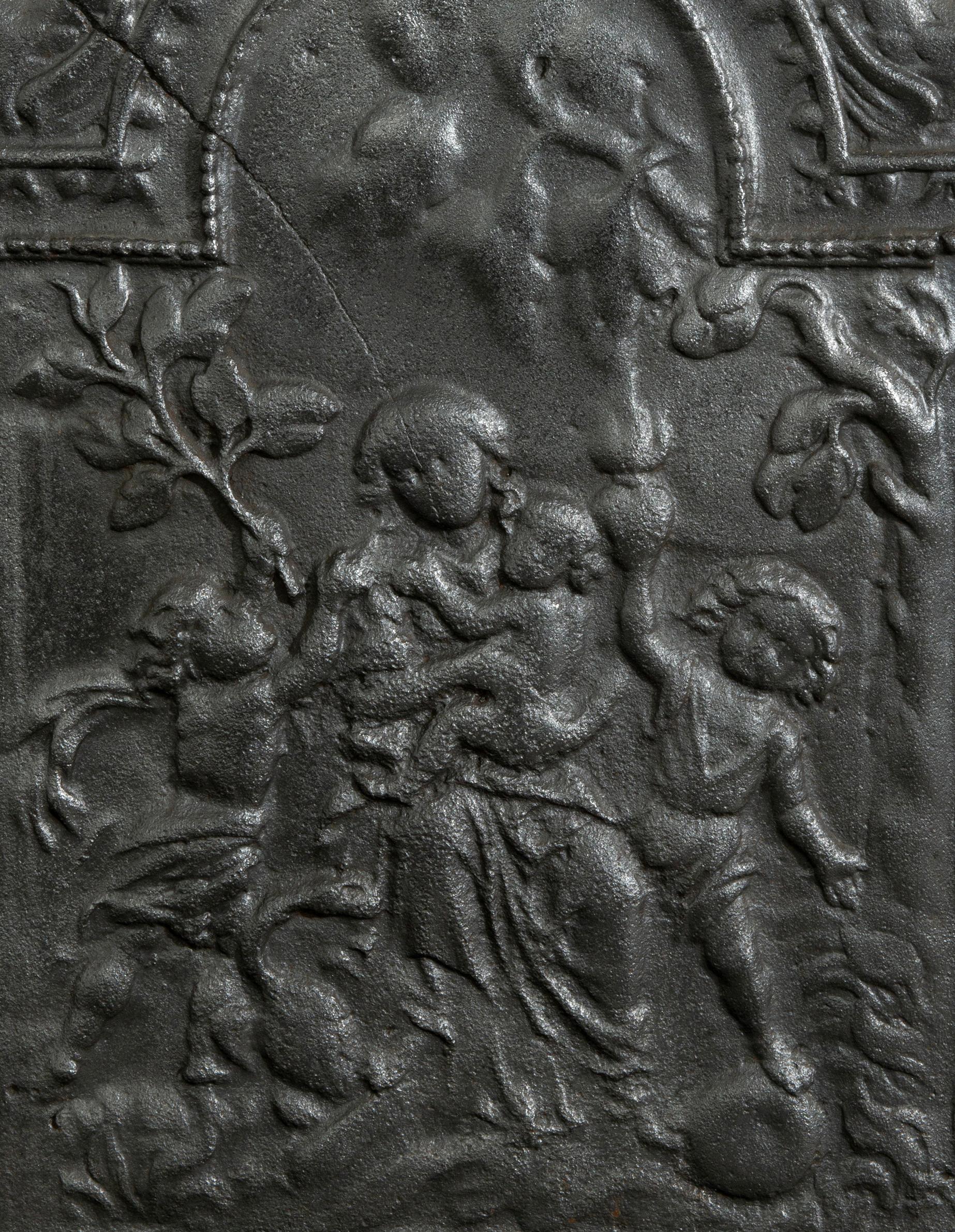 Plaque de cheminée antique en fonte 