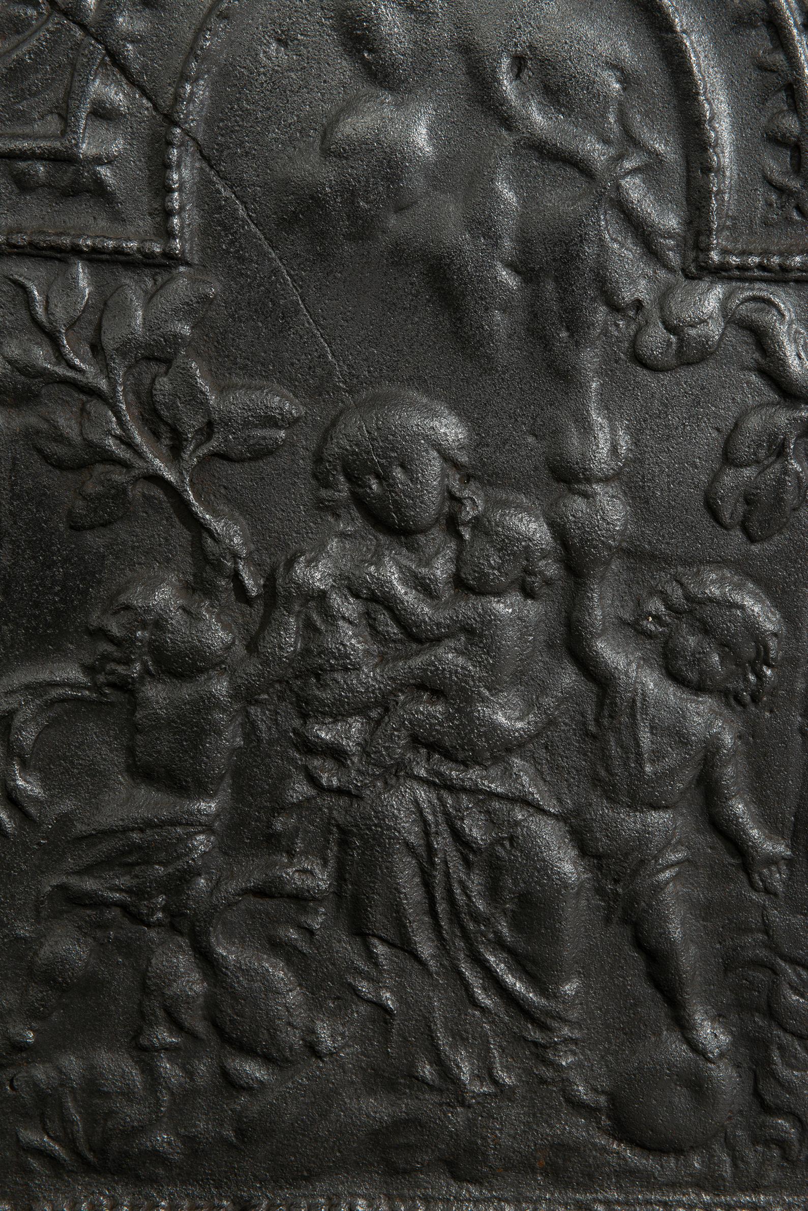 Plaque de cheminée antique en fonte 