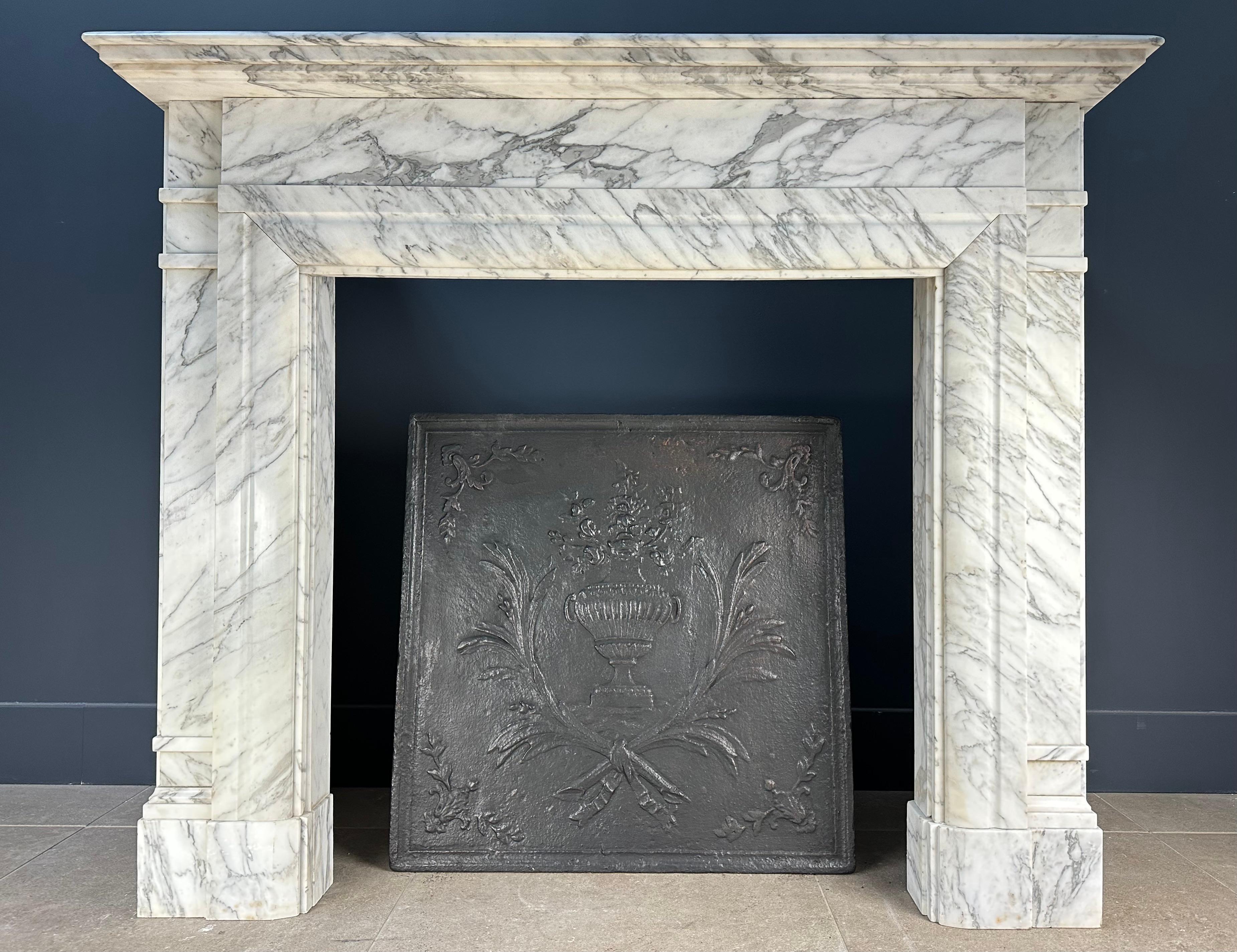 Beautiful l antique cast iron fireback. This fireback has a luxurious look. The fireback can be placed in a working fireplace against the fire wall or placed as a style item in an antique fireplace.