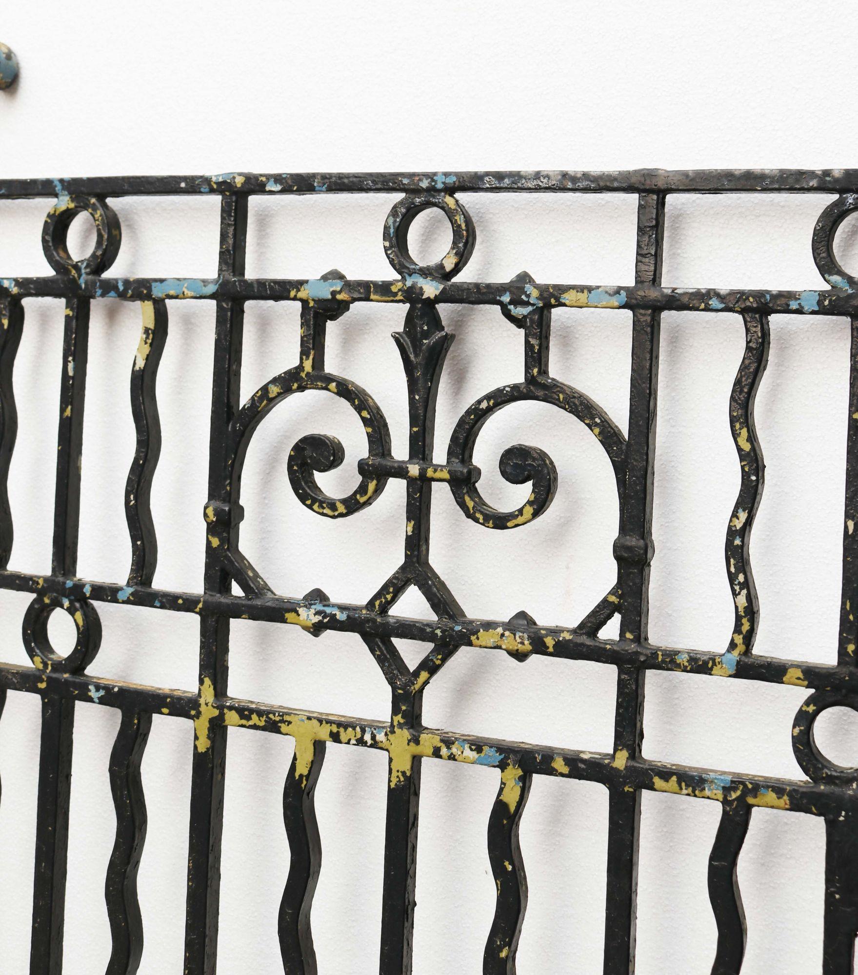 Antique Cast Iron Gate with Posts. A decorative side gate featuring some scroll work features in the centre, as well as two matching iron posts.

Additional Dimensions
Height of each post: 136 cm