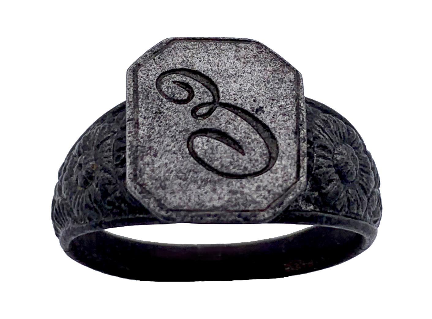 This cast iron signet ring is large in size and must therefore have been made for a man. The ring dates from the mid 19th century. Although the iron has oxydized with age, there are no signs of rust. 

US ring size 12.25/ 12.5, diameter 21.75