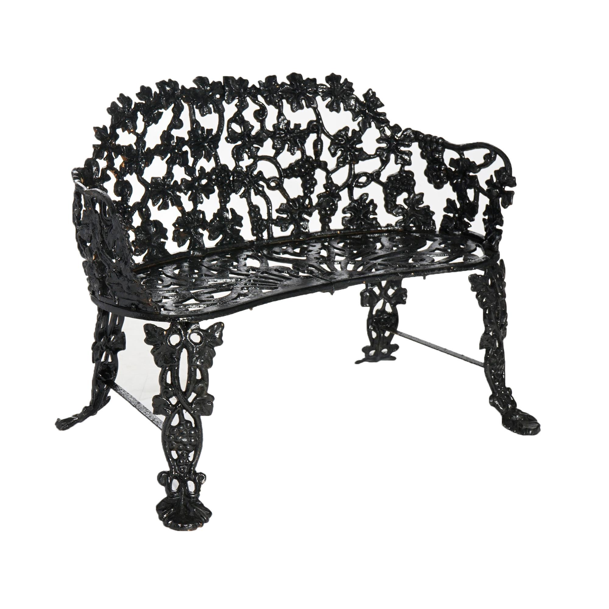 An antique garden bench offers cast iron construction in grape and leaf pattern, painted black, c1940.

Measures- 28''H x 37''W x 24.5''D.

*Ask about DISCOUNTED DELIVERY rates within 1,500 miles of NY*