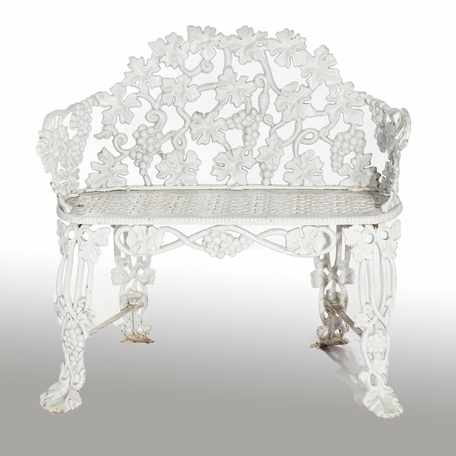 An antique garden bench offers cast iron construction in grape and leaf pattern, painted white, c1940.

Measures- 32.5''H x 32.5''W x 19.5''D; SH: 17.25''

Catalogue Note: Ask about DISCOUNTED DELIVERY RATES available to most regions within 1,500
