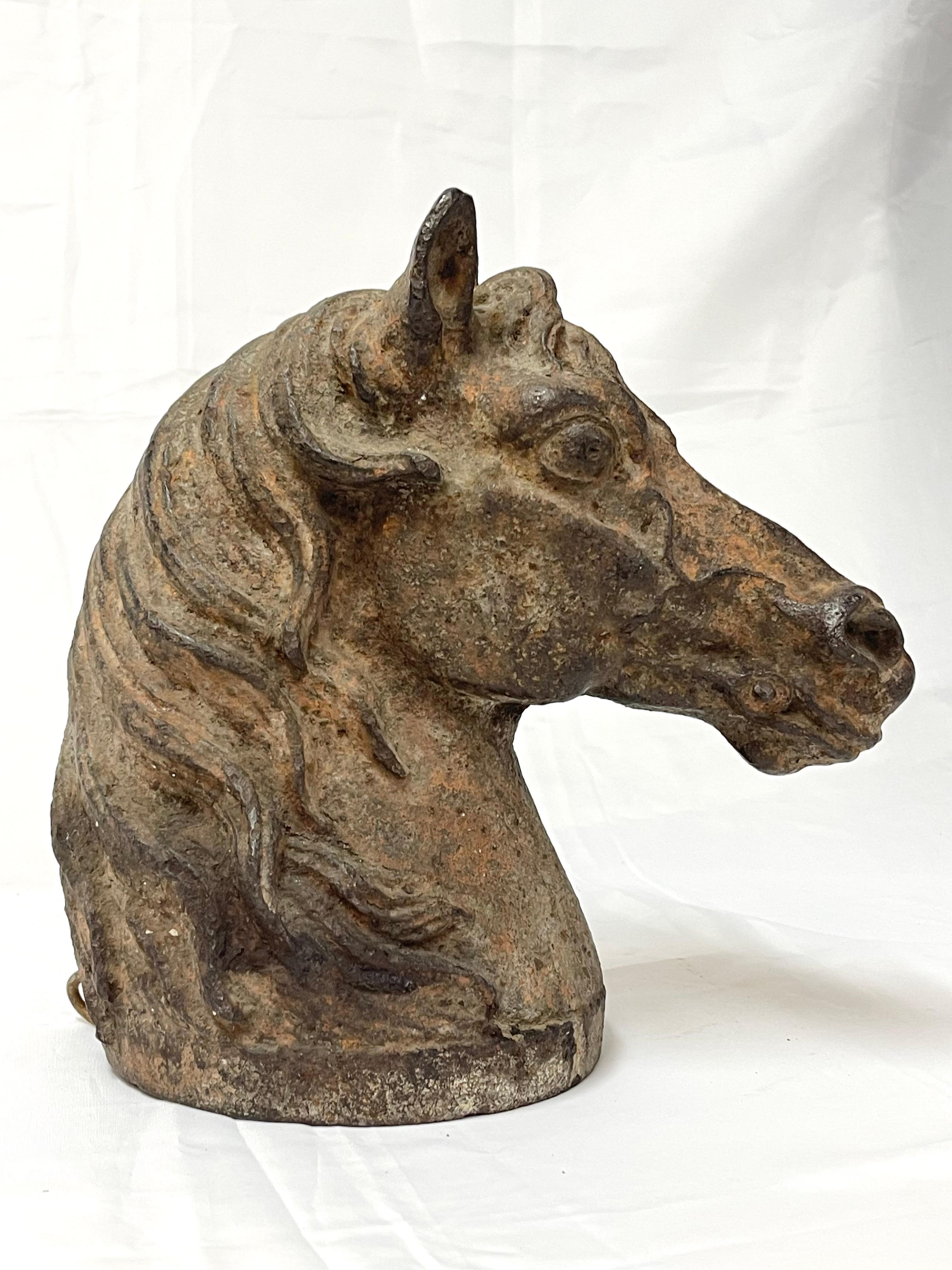 Antique Cast Iron Horse Head. Originally may have been mounted on a hitching post. Weathered and lovely rusted patina. Hollow but very heavy.