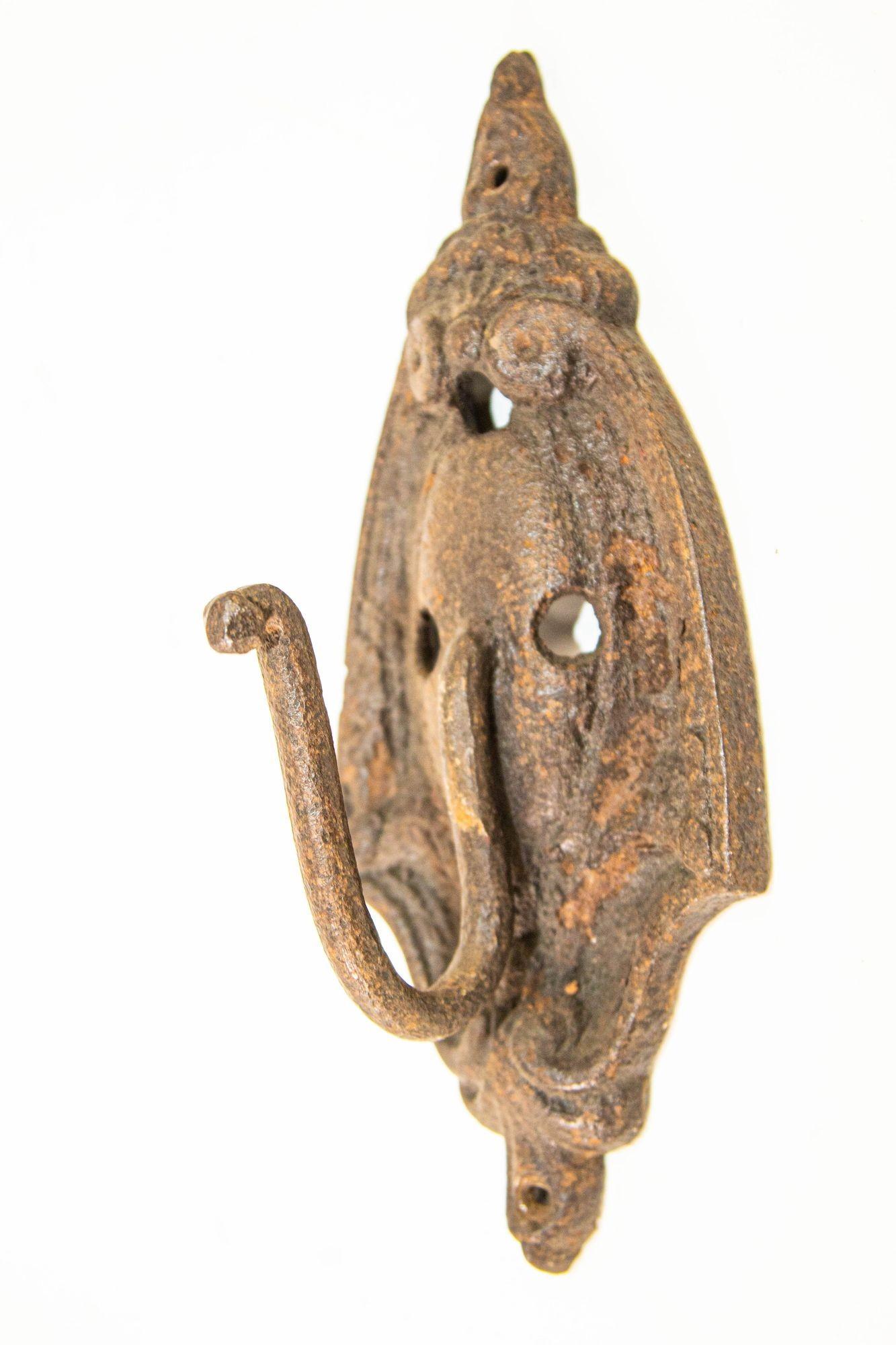 Antique Cast Iron Metal Wall Coat Hook In Distressed Condition For Sale In North Hollywood, CA