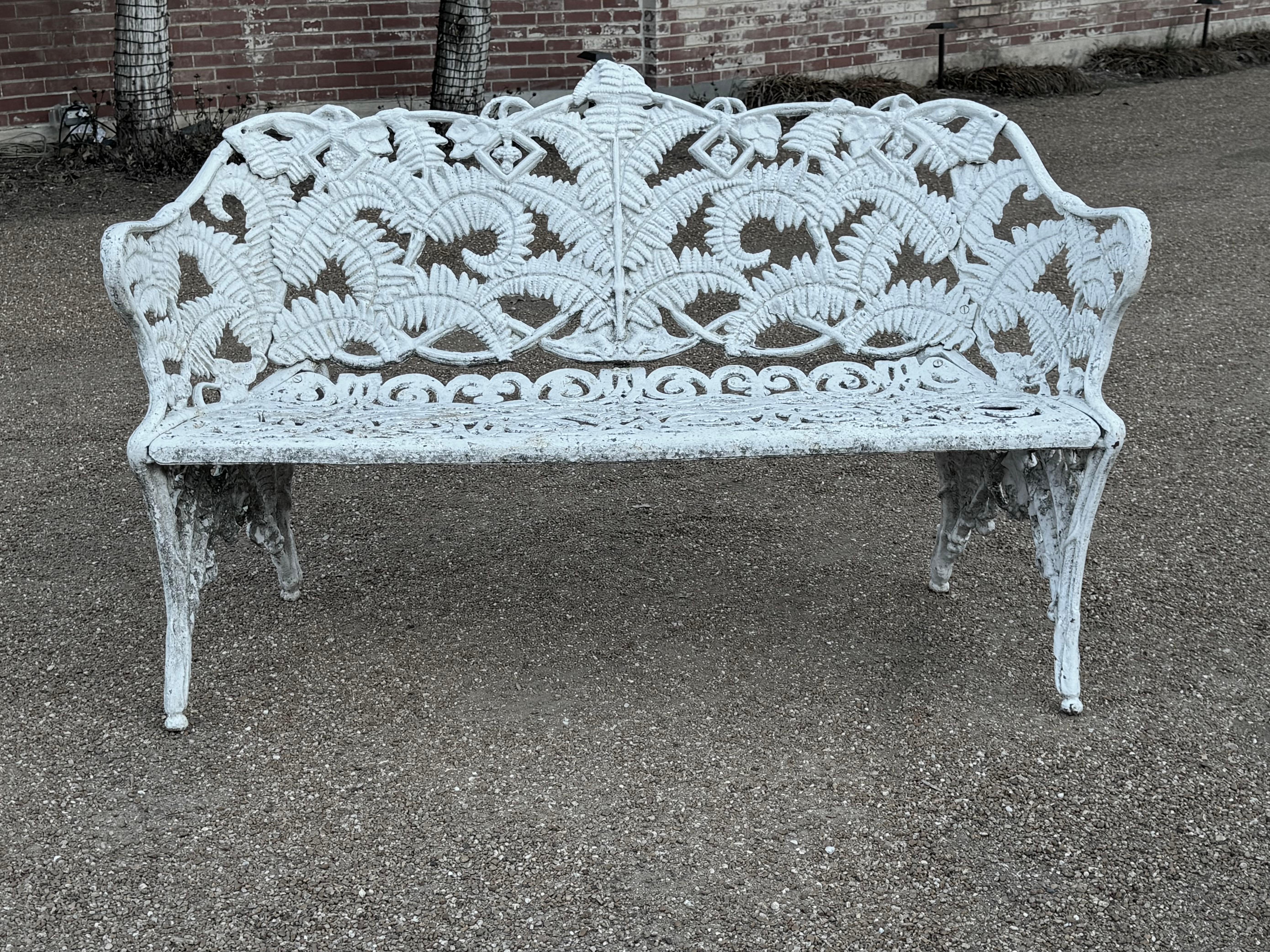 Antique very heavy cast iron Victorian English Style garden bench painted white having the Fern & Blackberry pattern. From an old St.Louis estate with Architectural pedigree, paint shows age and soil, can be blasted and repainted for additional