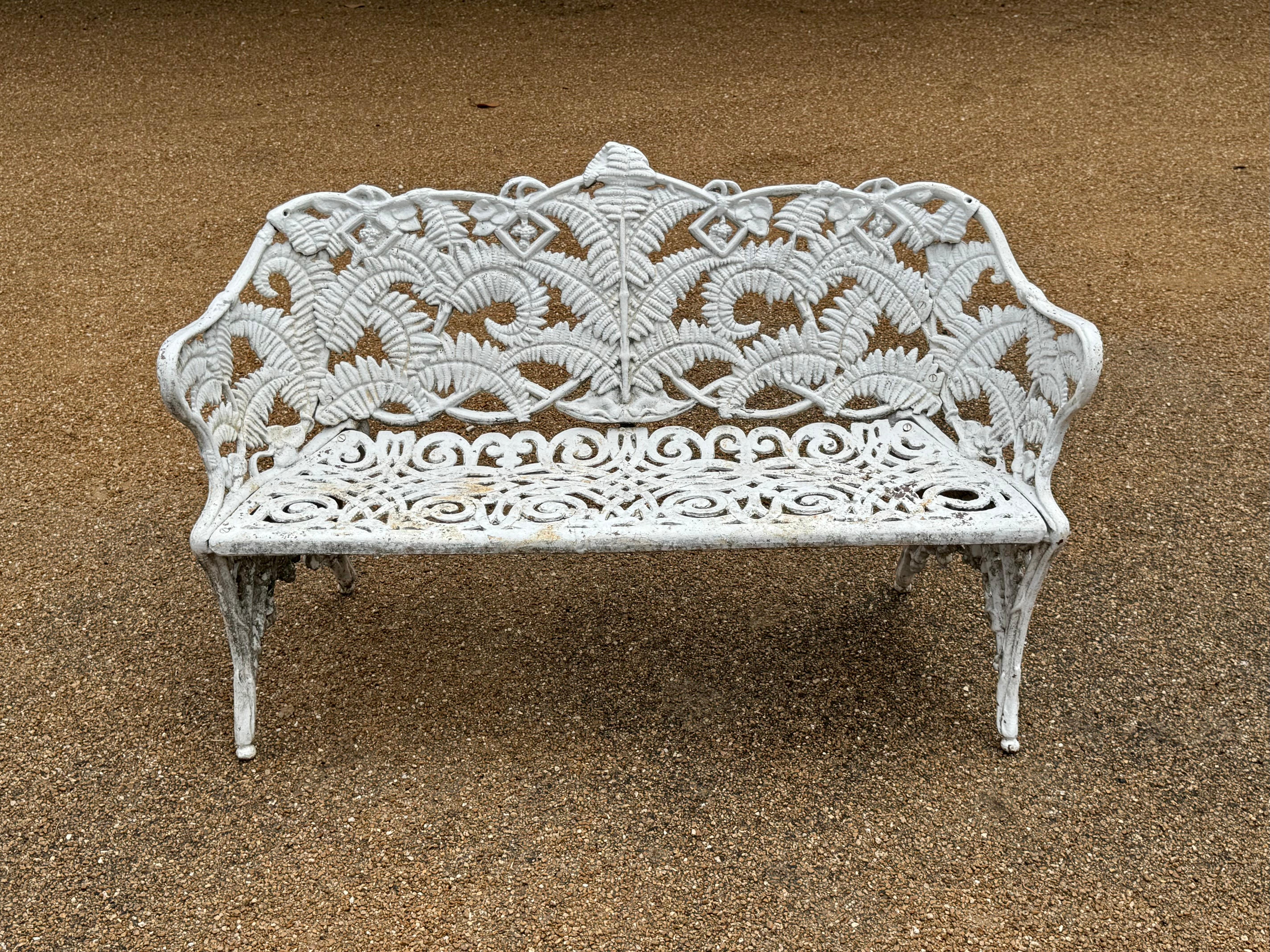 Antique very heavy cast iron Victorian English Style garden bench painted white having the Fern & Blackberry pattern. From an old St.Louis estate with Architectural pedigree, paint shows age and soil, can be blasted and repainted for additional