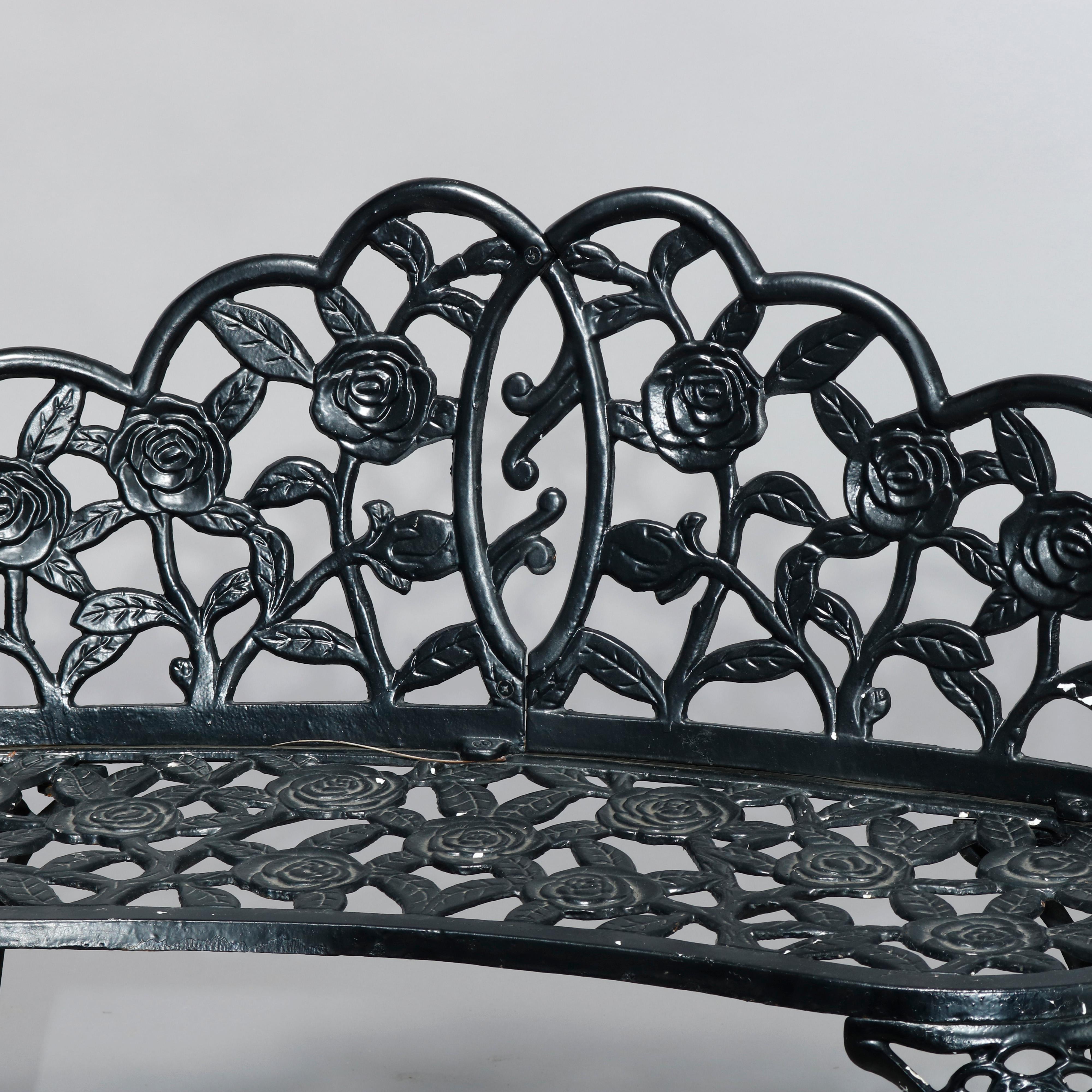 An antique garden bench offers cast iron construction with rose flower form frame, raised on cabriole legs, 20th century.

Measures: 30.5