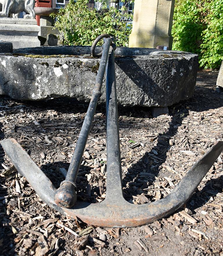 A beautiful antique cast iron ships anchor from the 19th century,
With a heavily patinated finish on the cast iron.