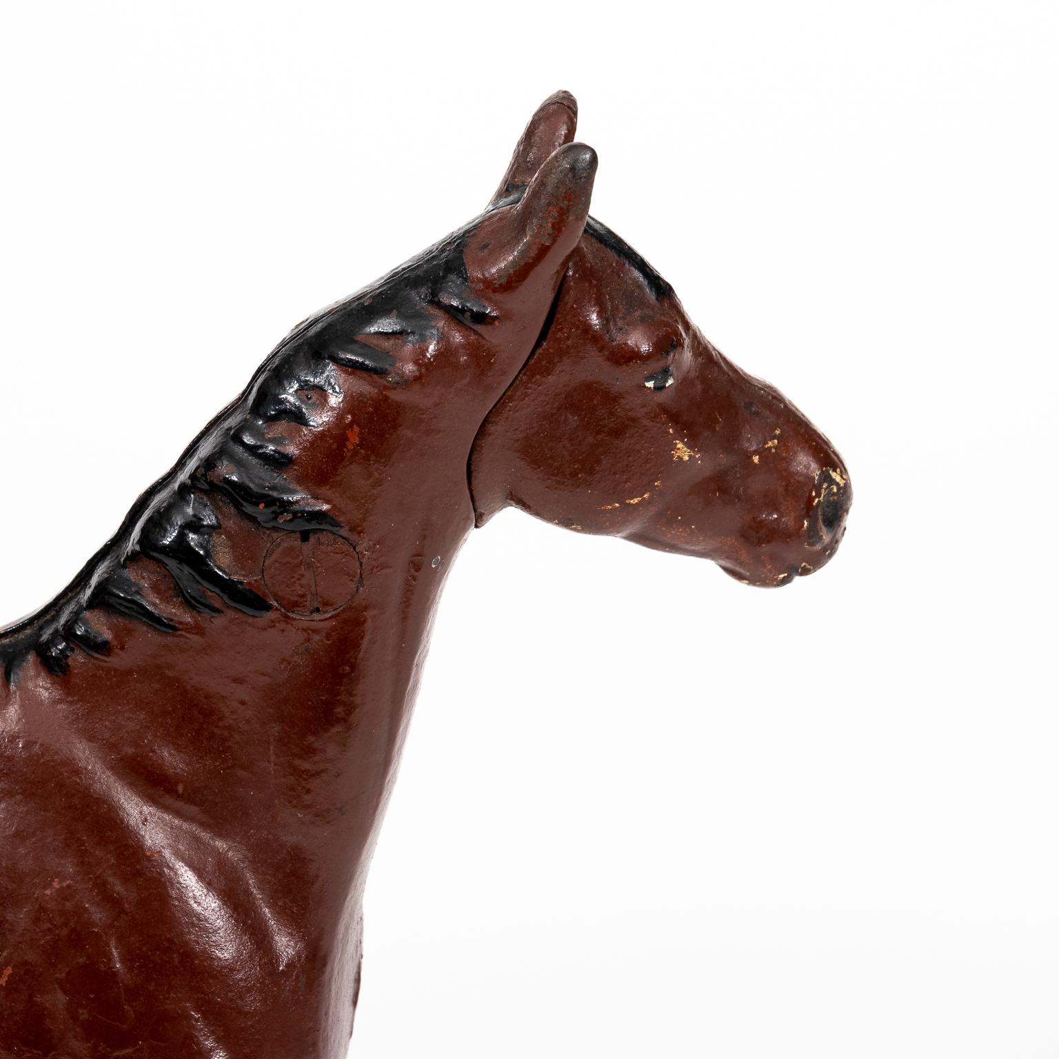 Antique large cast iron though bred horse door stop by the Hubley Manufacturing Company in Lancaster, PA, circa 1940s. This piece is 10.00 inches tall and 11.50 inches long. Made in the United States. Please note of wear consistent with age