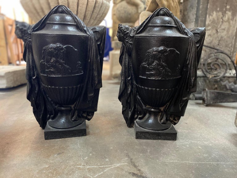 Here we have a pair of cast iron urns.

Origin: France, circa 1890

Measurements: 22