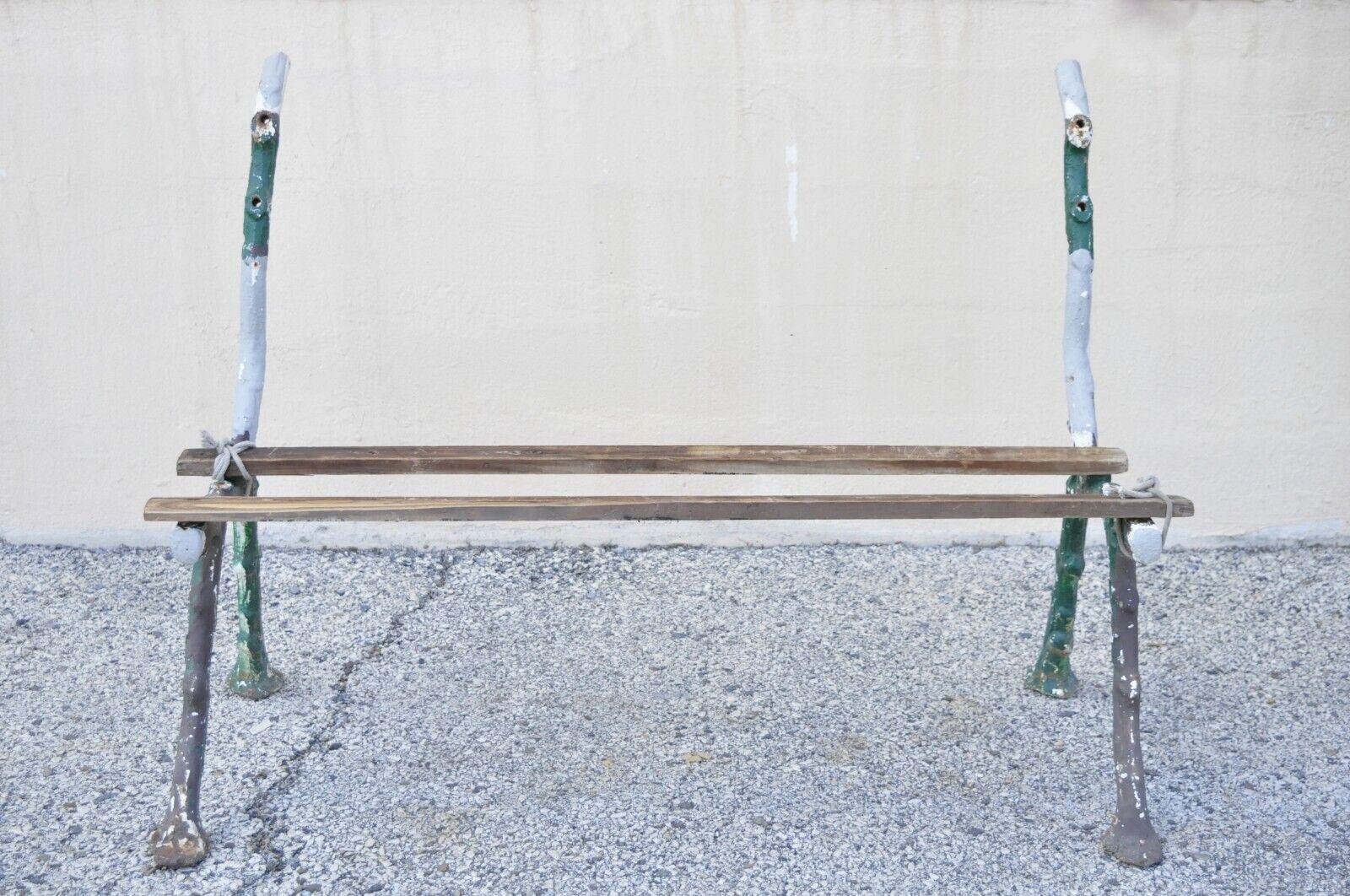 Antique cast iron Victorian Faux Bois branch white Twig garden bench legs - pair. Item features heavy cast iron construction, white distress painted finish, back has 2 holes for wood slats, seat has 4 holes for wood slats, each leg approx. 30 lbs