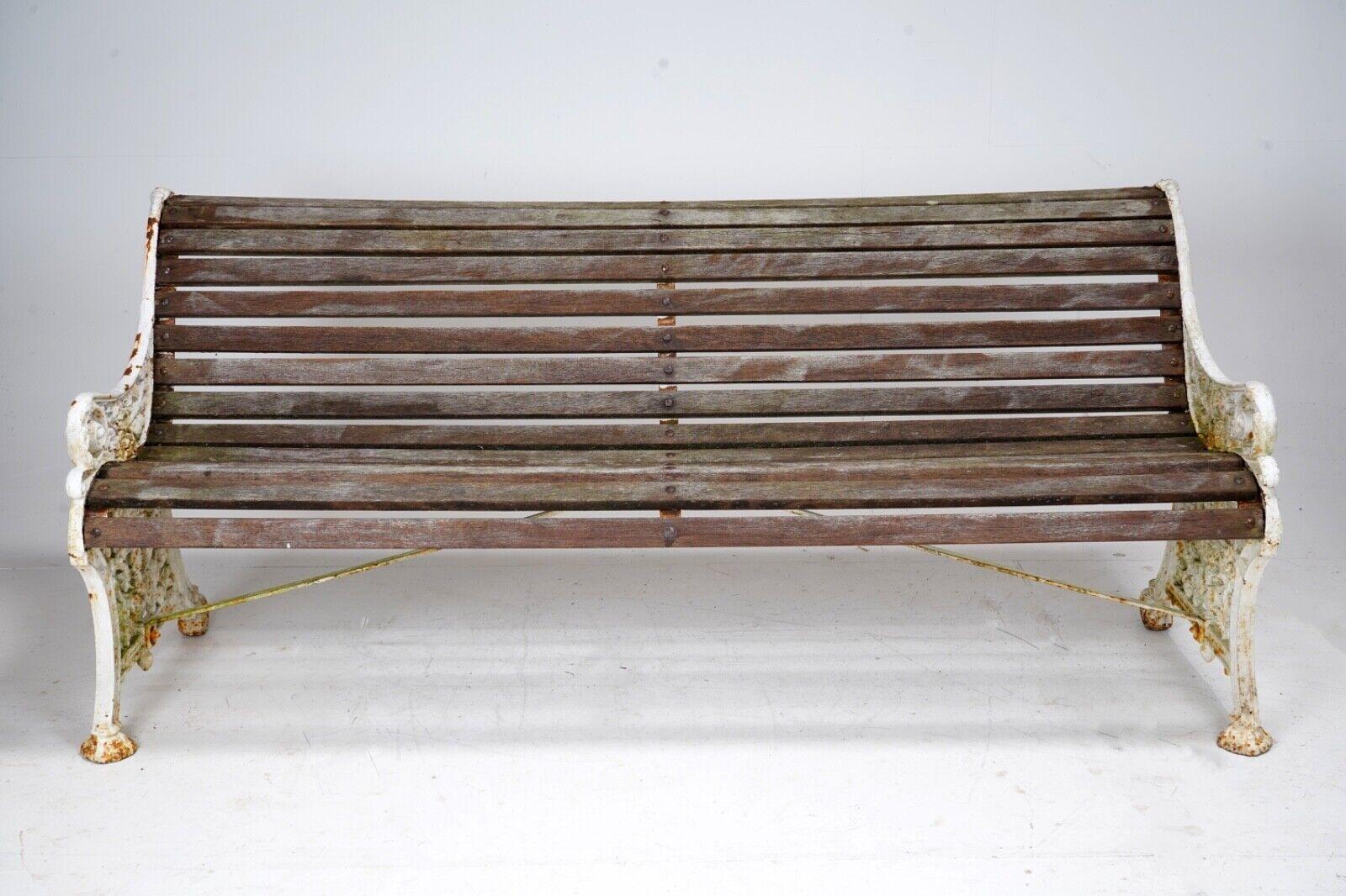 A beautiful quality large victorian cast iron garden bench. 
The bench ends have a been lavishly decorated, a Victorian crown surrounded by flowers representing the different parts of the UK. 
Slates made from teak, and in good solid condition.