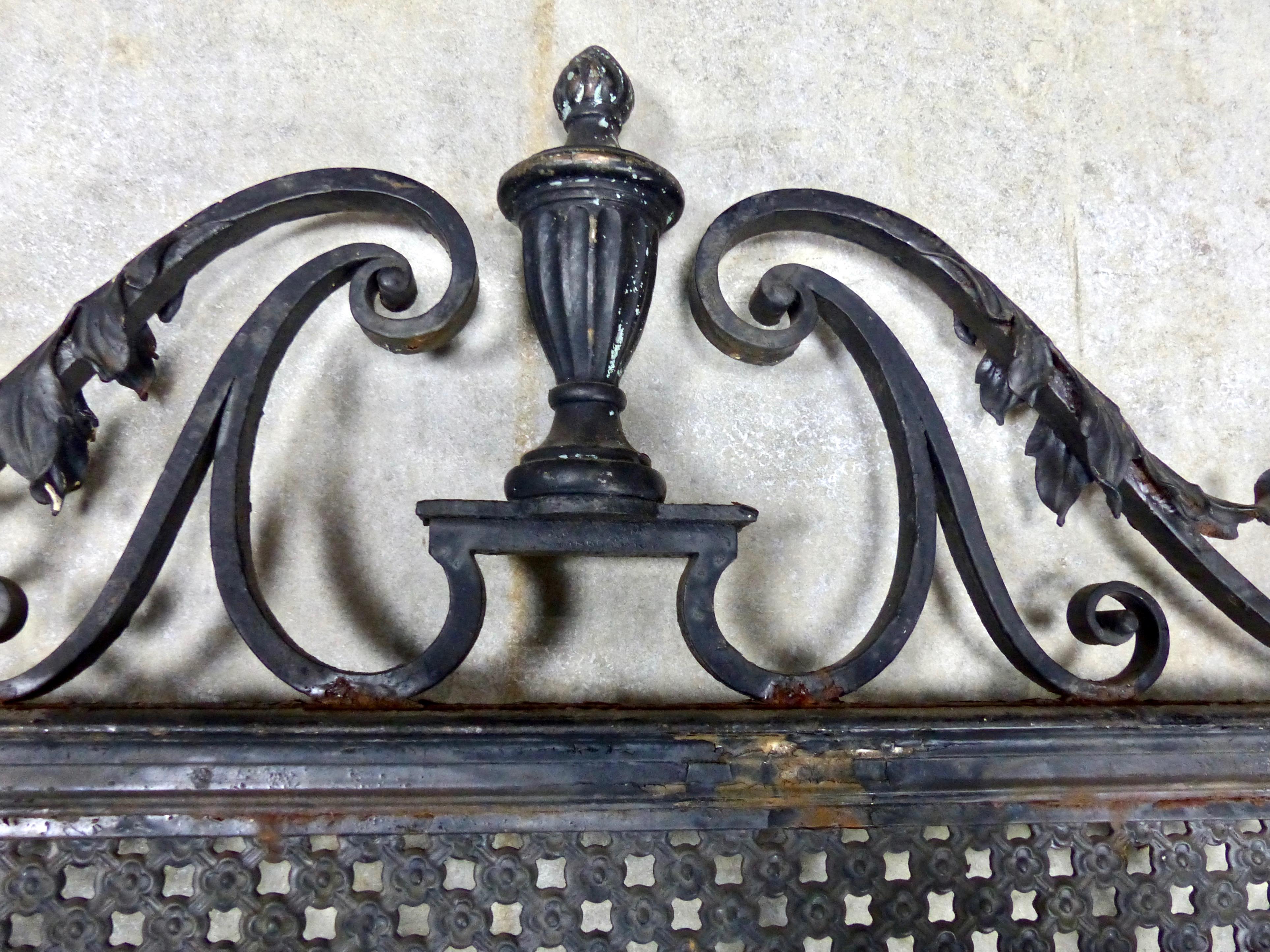 The original security system: an ornate cast iron grate over a window. 
Wall art.
 Wonderful design and details in a formerly utilitarian object. Found in New York City. Dimensions: 70 H” x 47 W” x 3 D”.