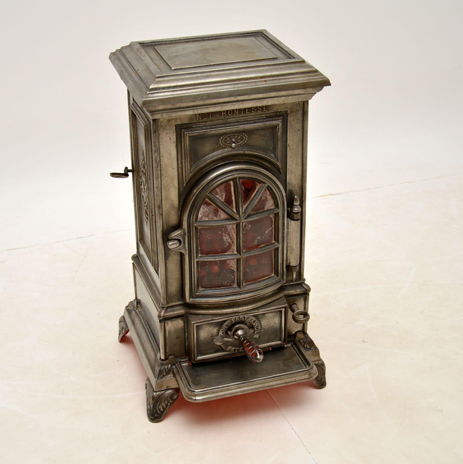 A magnificent antique cast iron coal burner stove, this is the Model 1 by Bontesse. It was made in England and dates from around 1890-1910.

Bontesse was the forerunner to Artesse, Francesse and the company now known as Esse, which still make high