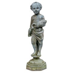 Antique Cast Lead French Style Garden Statue Of A Putto With Wheat Sheaf