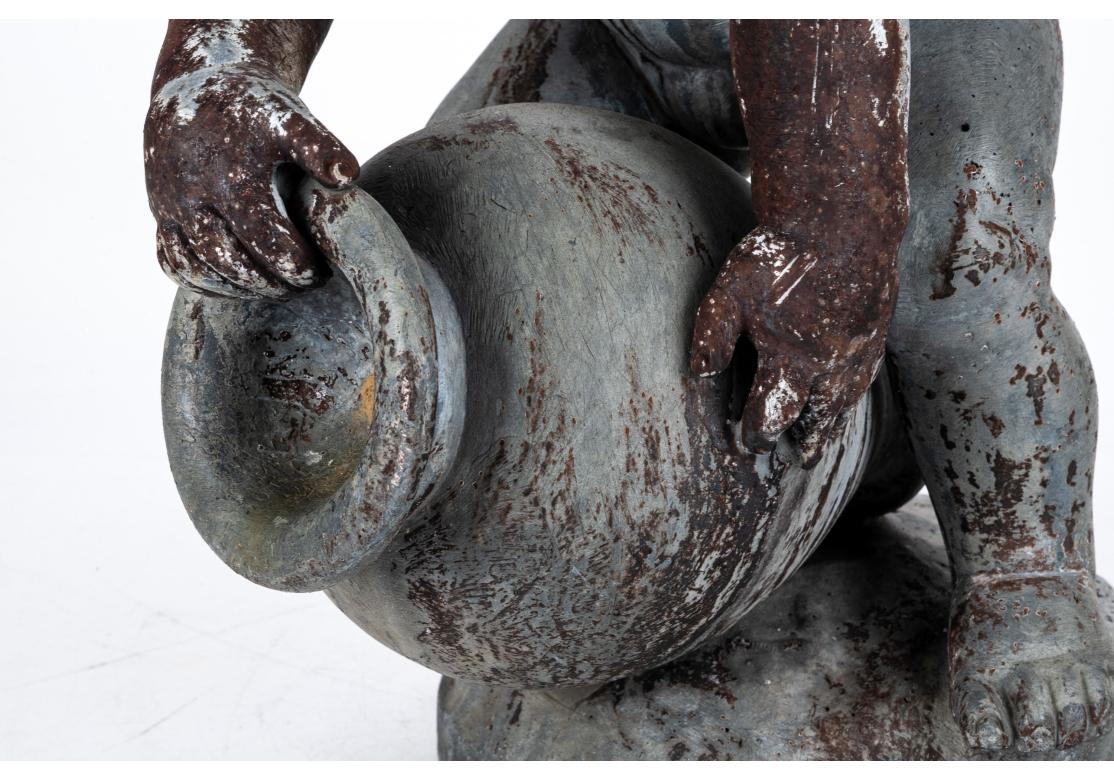 Antigua figura de jardín de plomo fundido de un putto siglo XIX en venta