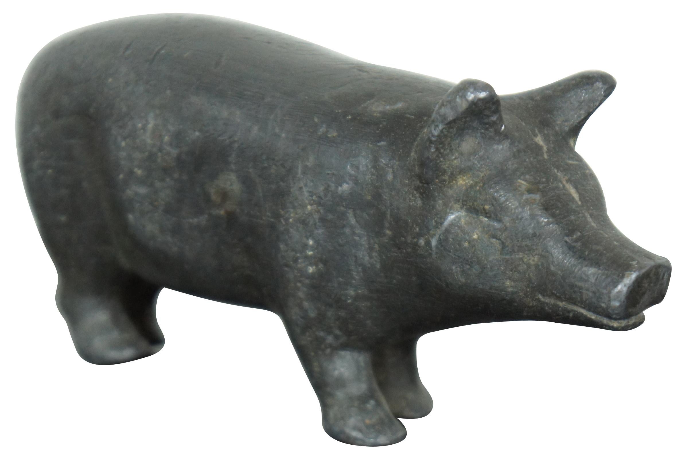 Very solid and heavy cast lead figurine or paperweight in the shape of a pig.
